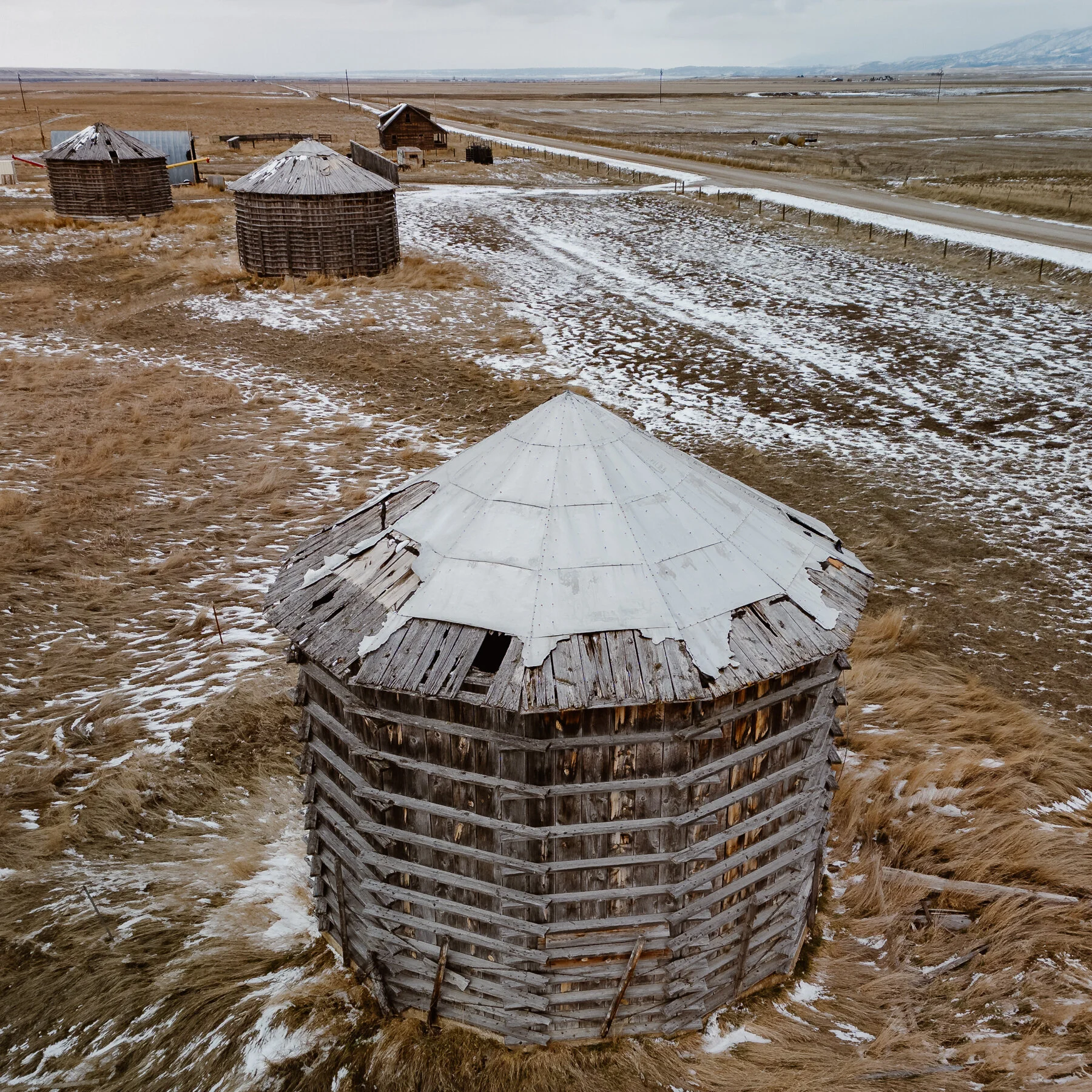 A cold, dreary day road trip with the drone. Wooden grain bins, train trussell, and an old homestead. 

#grainbins #railroad #traintrussell #AerialPhotography #Montana #centralmontana