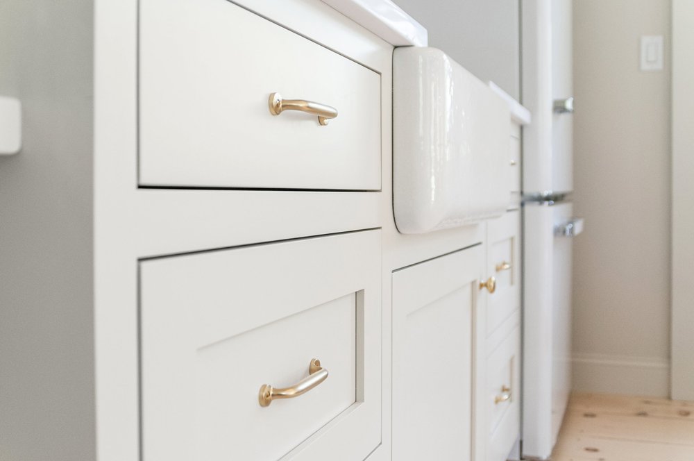 Unlacquered brass cabinet hardware detail