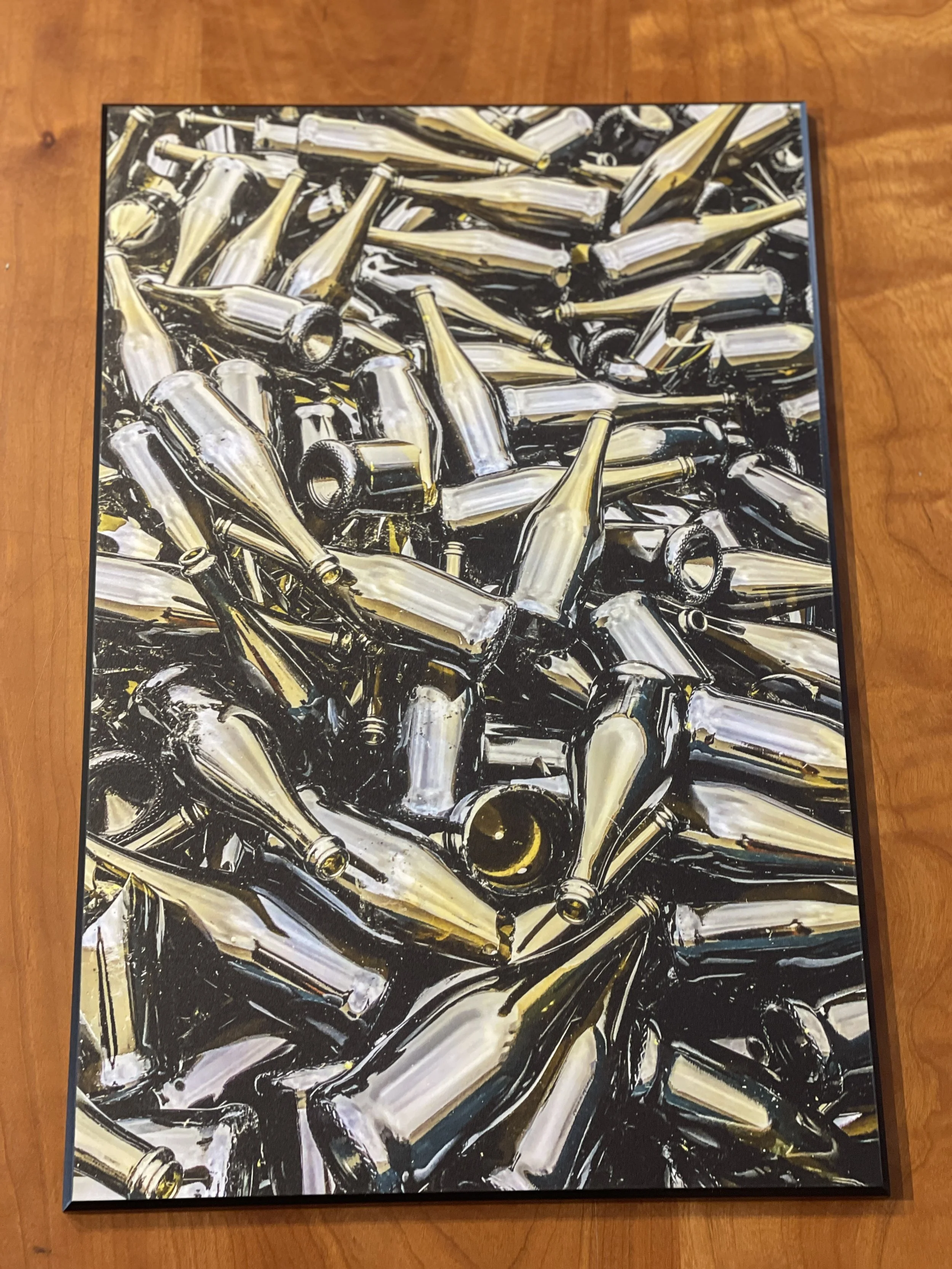 Painting of numerous aluminum bottles piled together on a wooden surface.