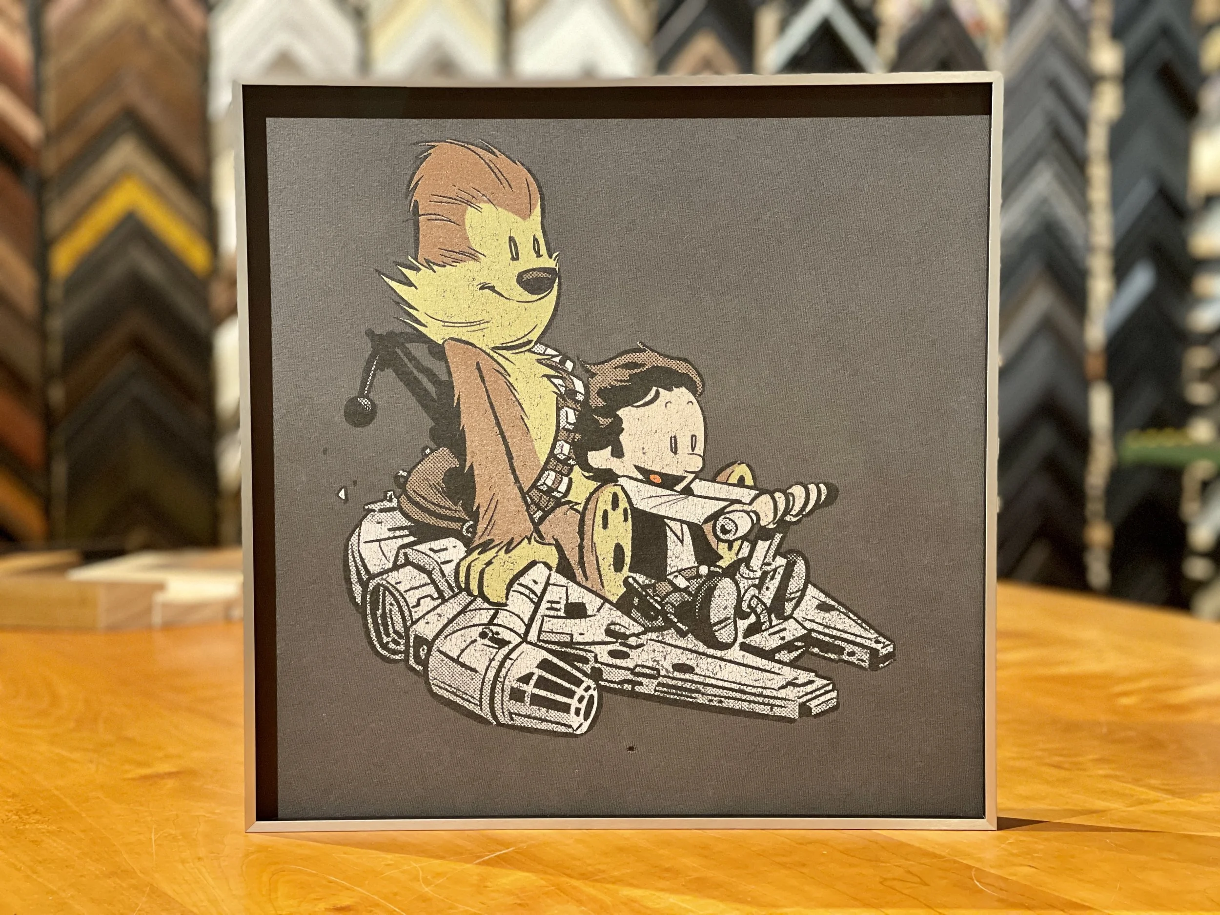 Illustration of a Yoda-like character in a wheelchair and a young boy with dark hair riding a hovercraft with mechanical parts.