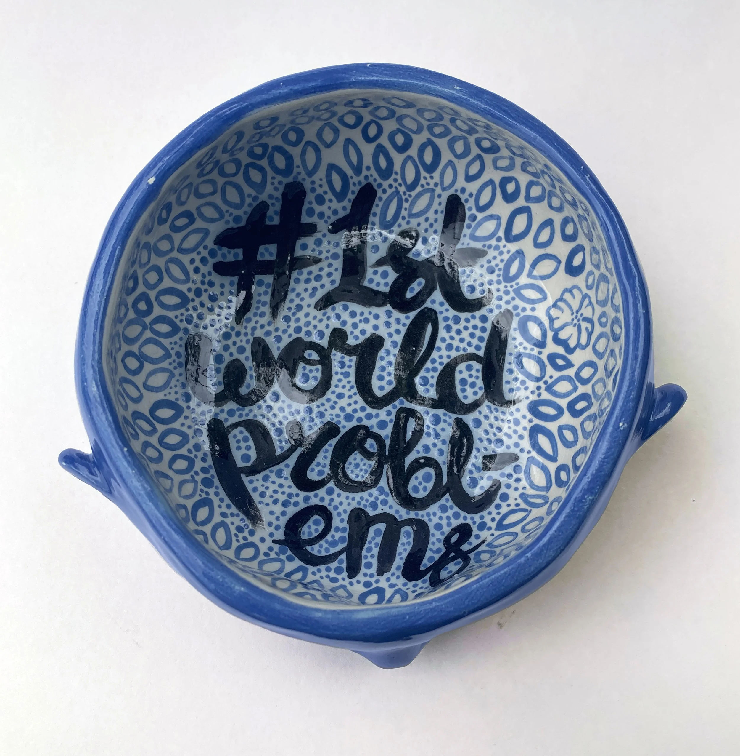 photo of inside bowl showing text 'first world problems'