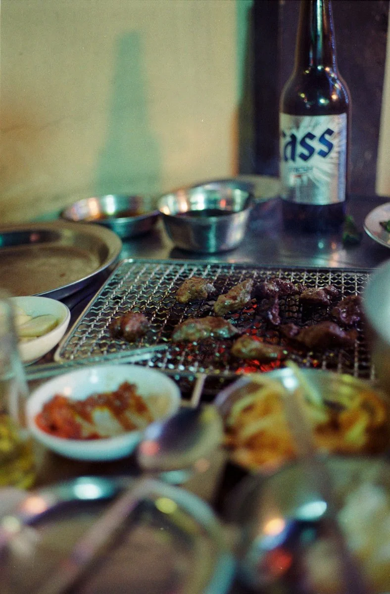korean bbq on grill * cass beer * outdoor * street food * summer night * ennis 35mm film street photography south korea seoul * 2012