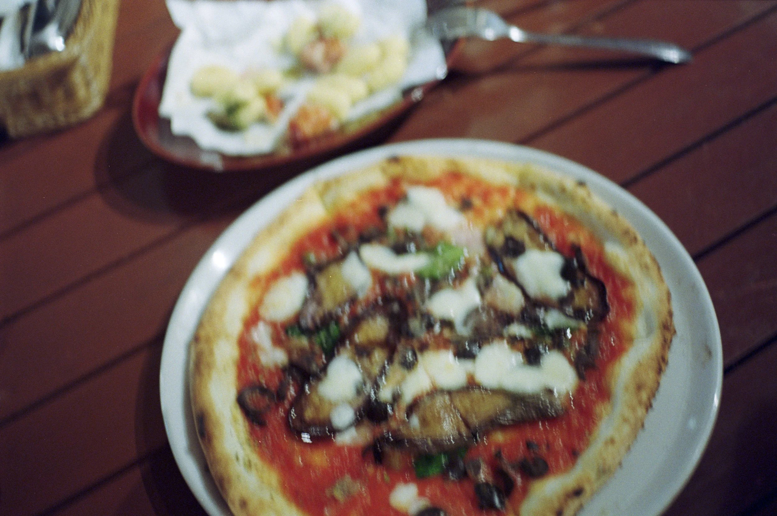 blurry photo of Neapolitan pizza * ennis 35mm film photography japan street 2012