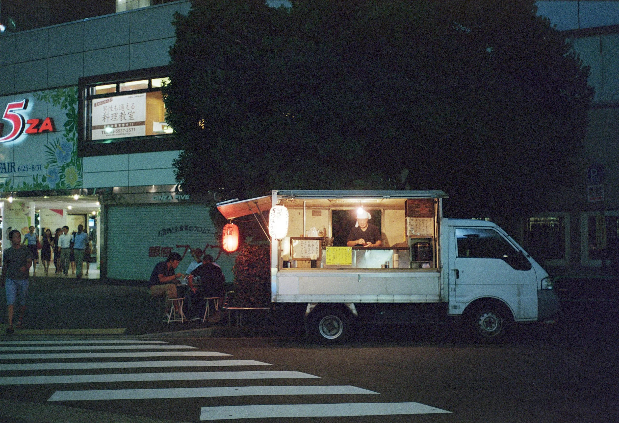 little japanese food truck glowing at night ennis 35mm film photography japan street 2012