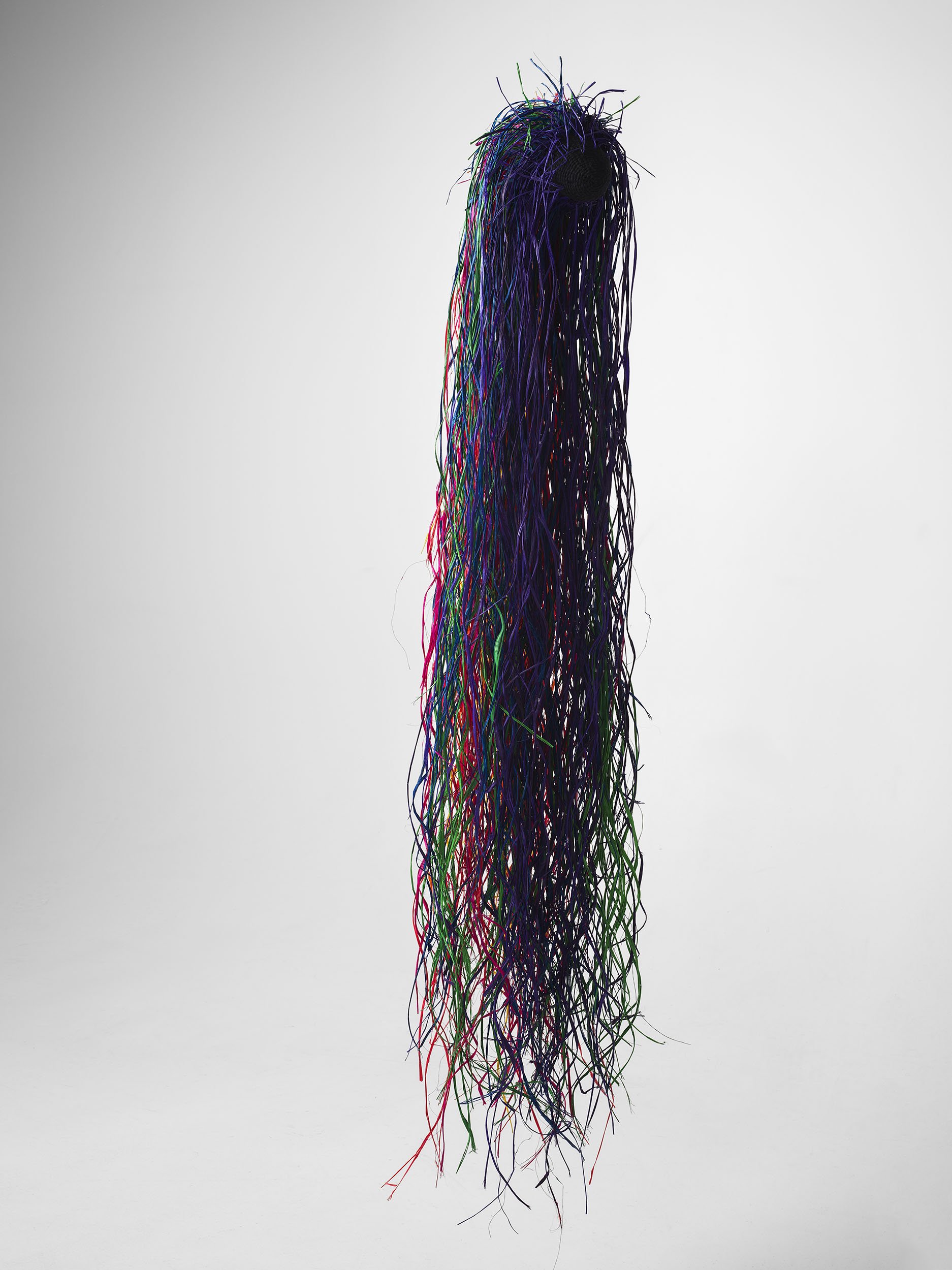 Between III. Raffia, wool, pallet wrap. 
150 x 35 x 35cm