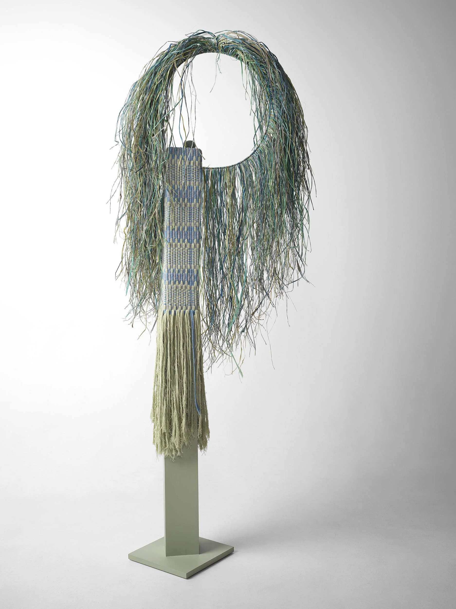 The Guardians - Stillness. 
Recycled cotton string, raffia, plaster, wood.  
195 x 75 x 30cm