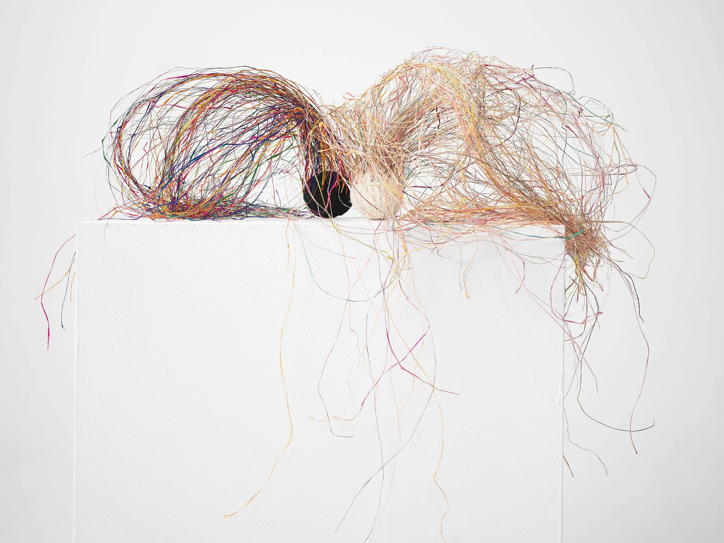 Light & Shadow. 
Wool, raffia wisps, pallet wrap.
15 x 60 x 40cm