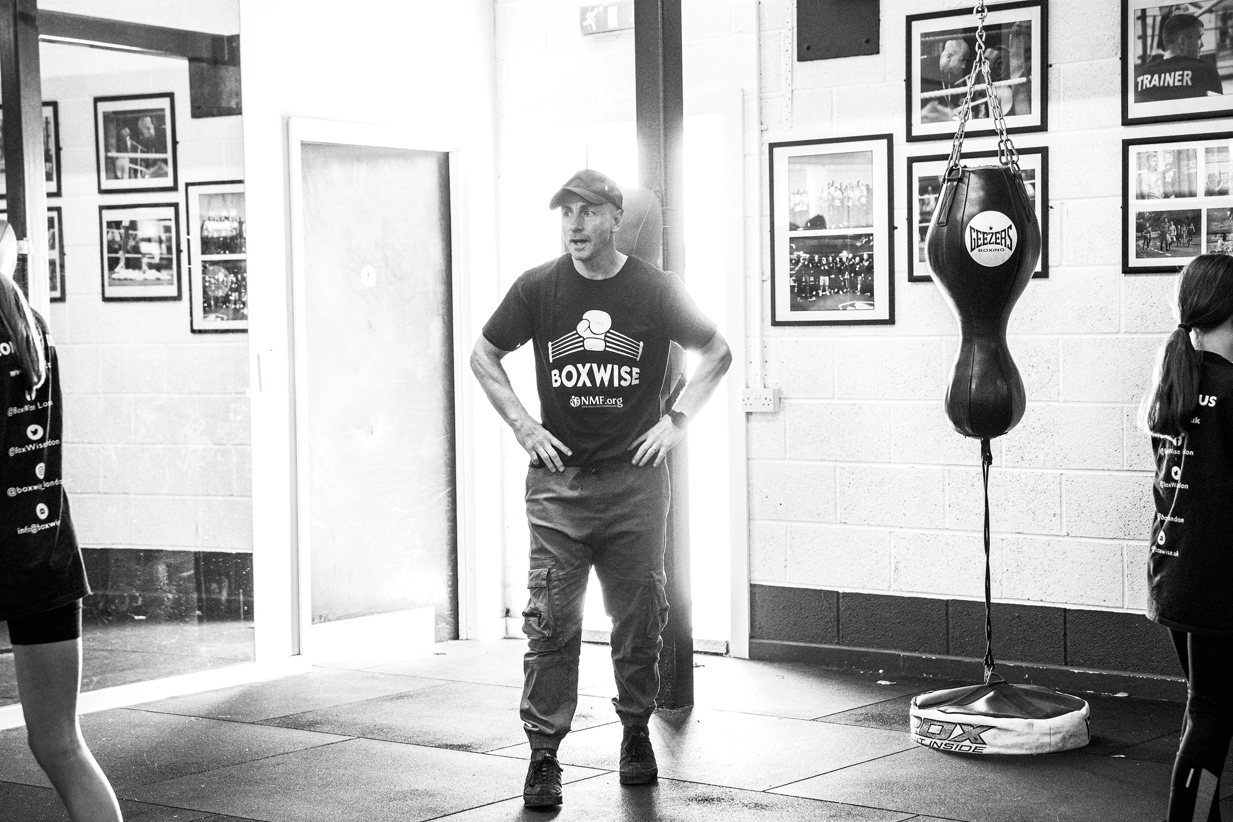 A man wearing a Black T-shirt with 