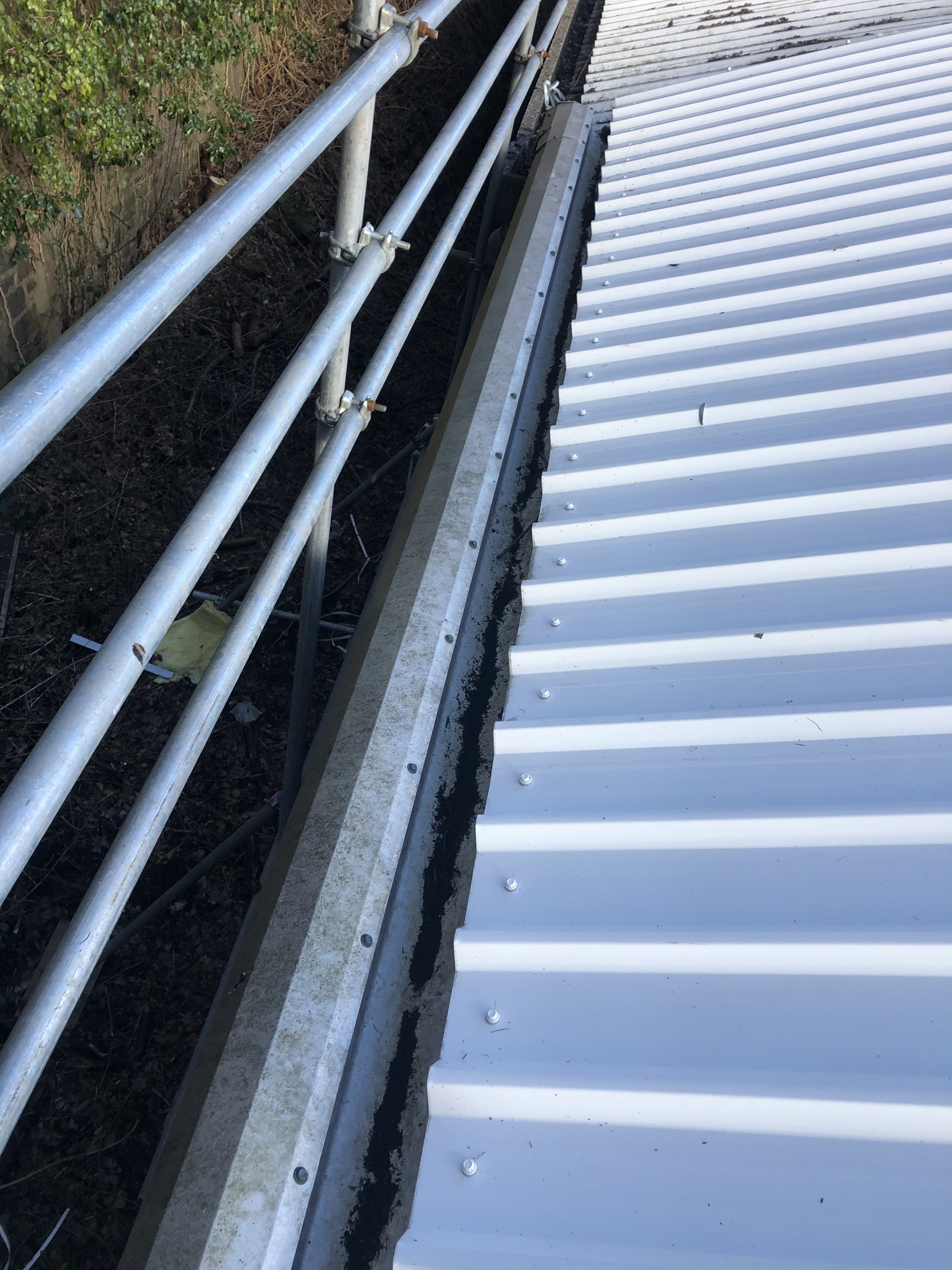 Corrugated metal roof with scaffolding