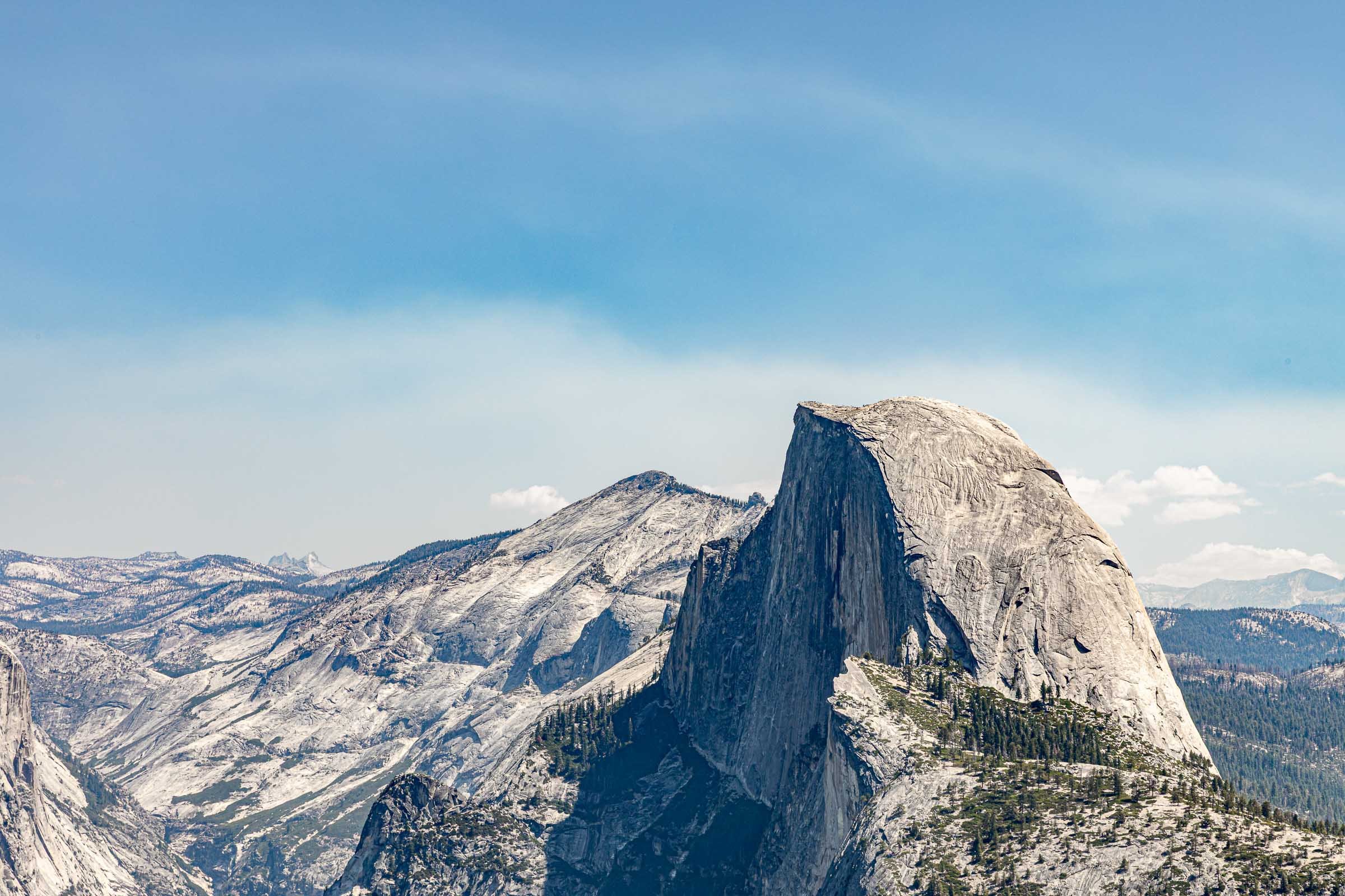 Yosemite Half Dome granite mountain peak with pine forest California national park