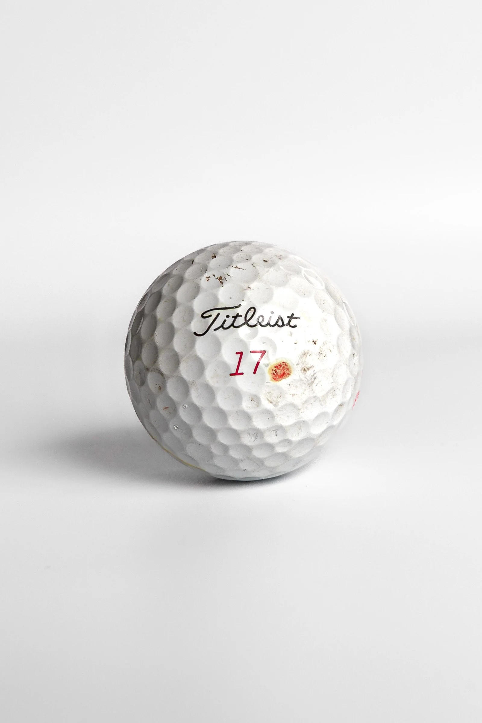 Titleist Pro V1x golf ball with red number seventeen and dot mark white background