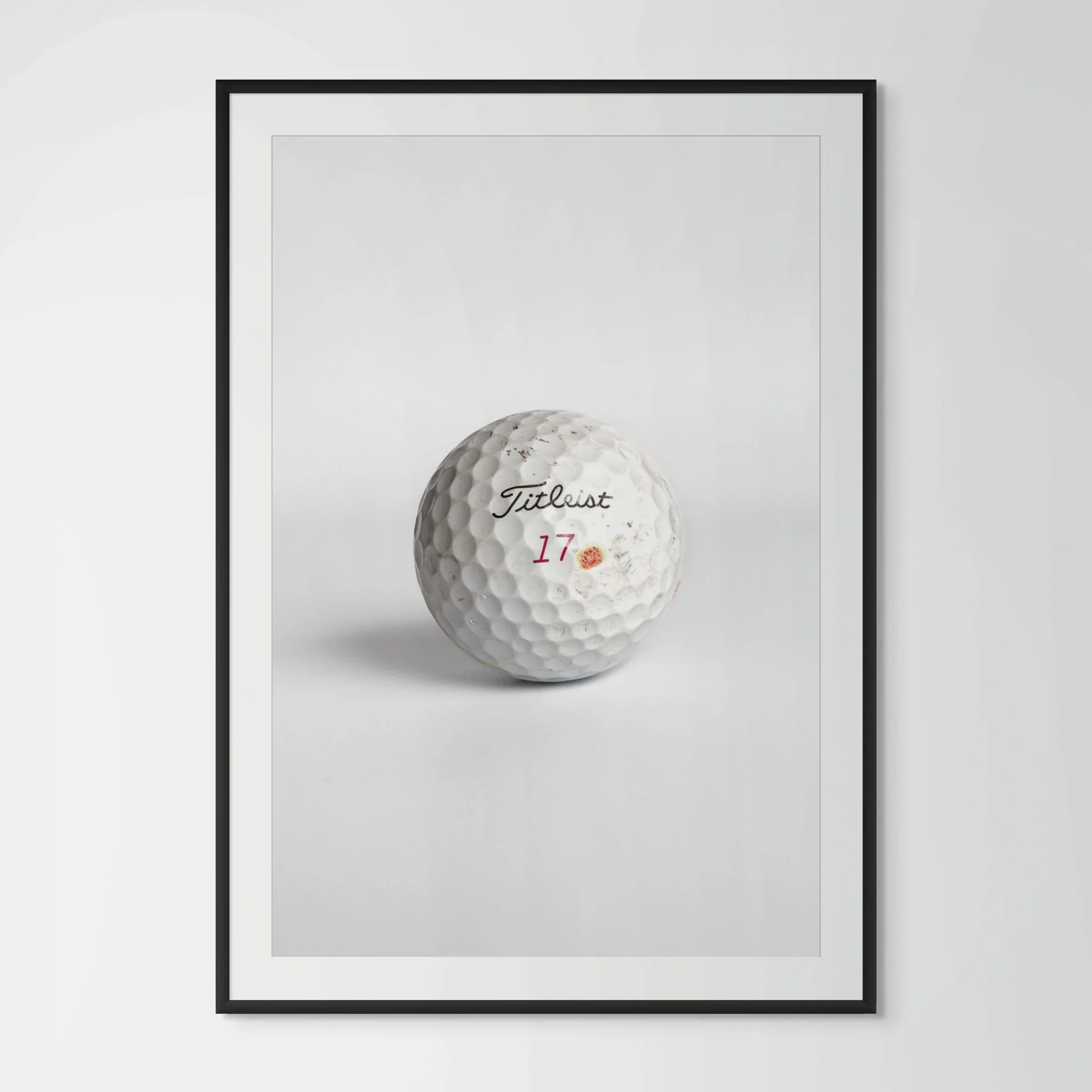 Titleist Pro V1x number seventeen golf ball framed photography print in black wood frame