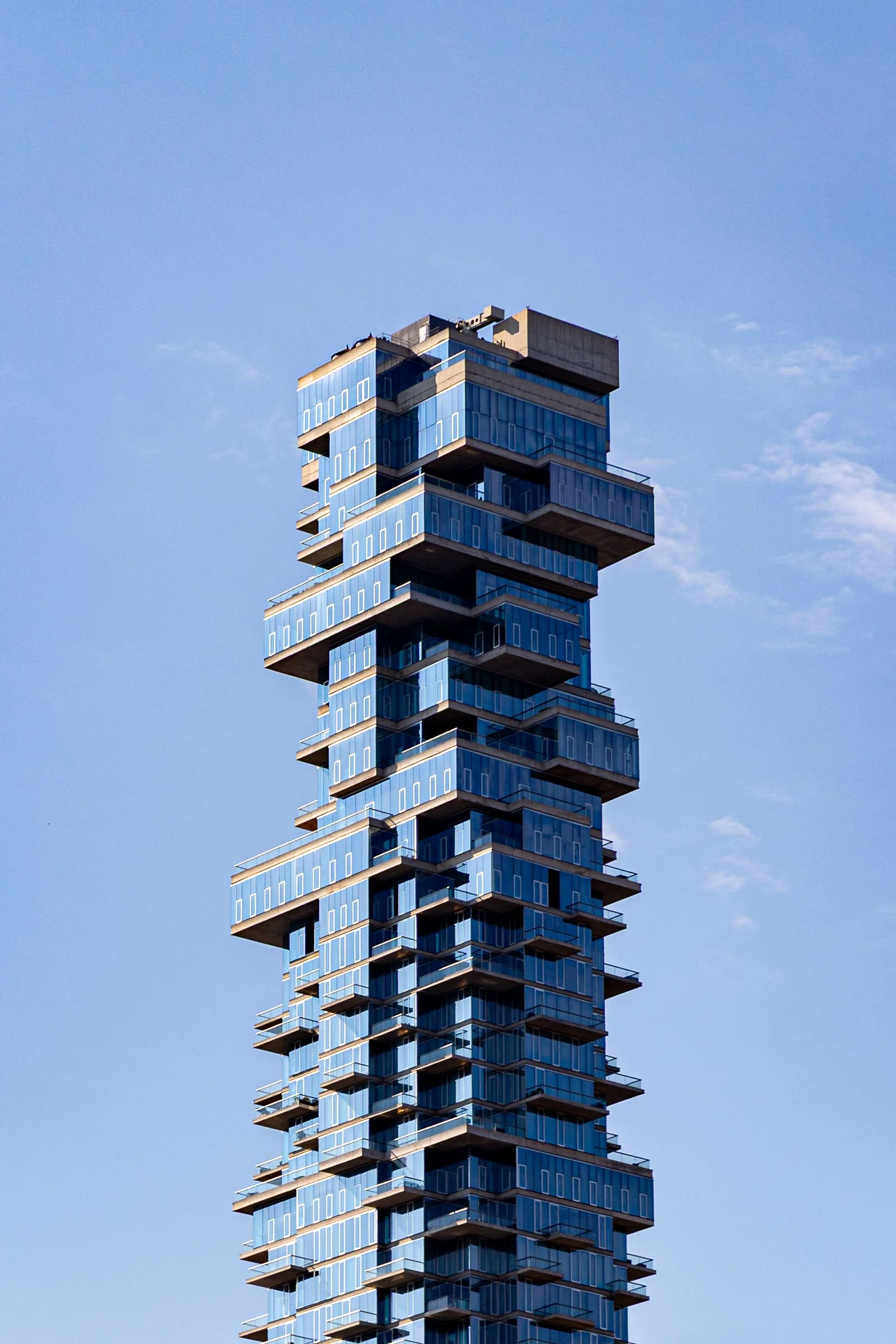 New York City residential tower with glass balconies and blue sky Manhattan (Copy)