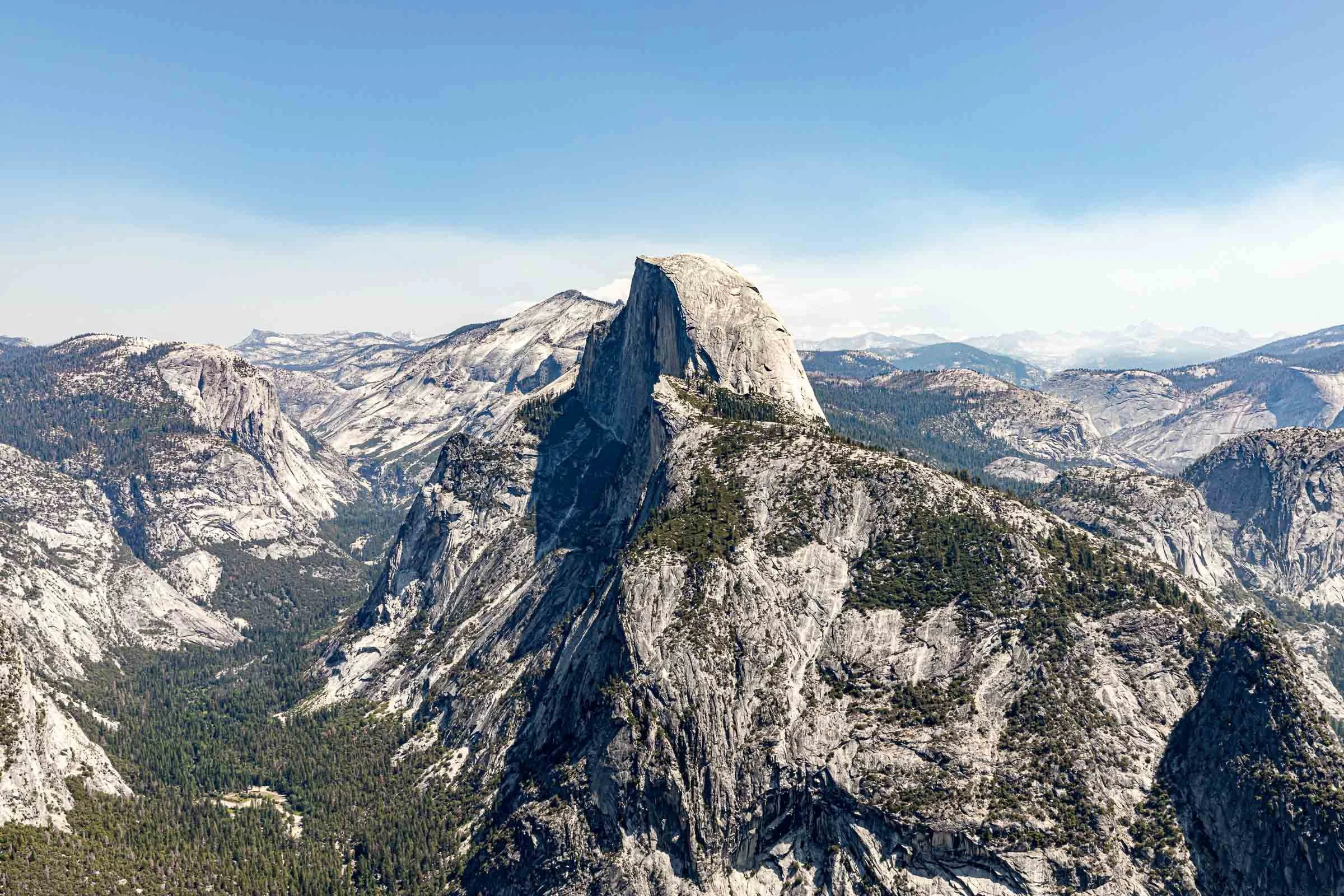 Yosemite valley vista from Glacier Point with granite cliffs and forest California