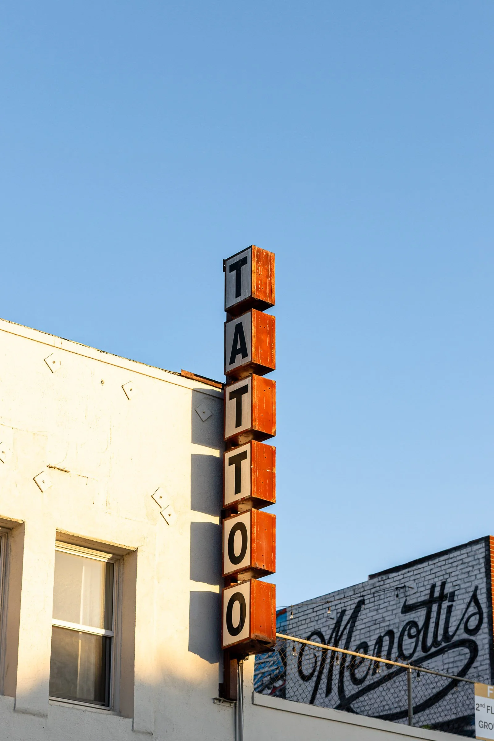 Venice Beach tattoo parlor storefront with vintage signage in California