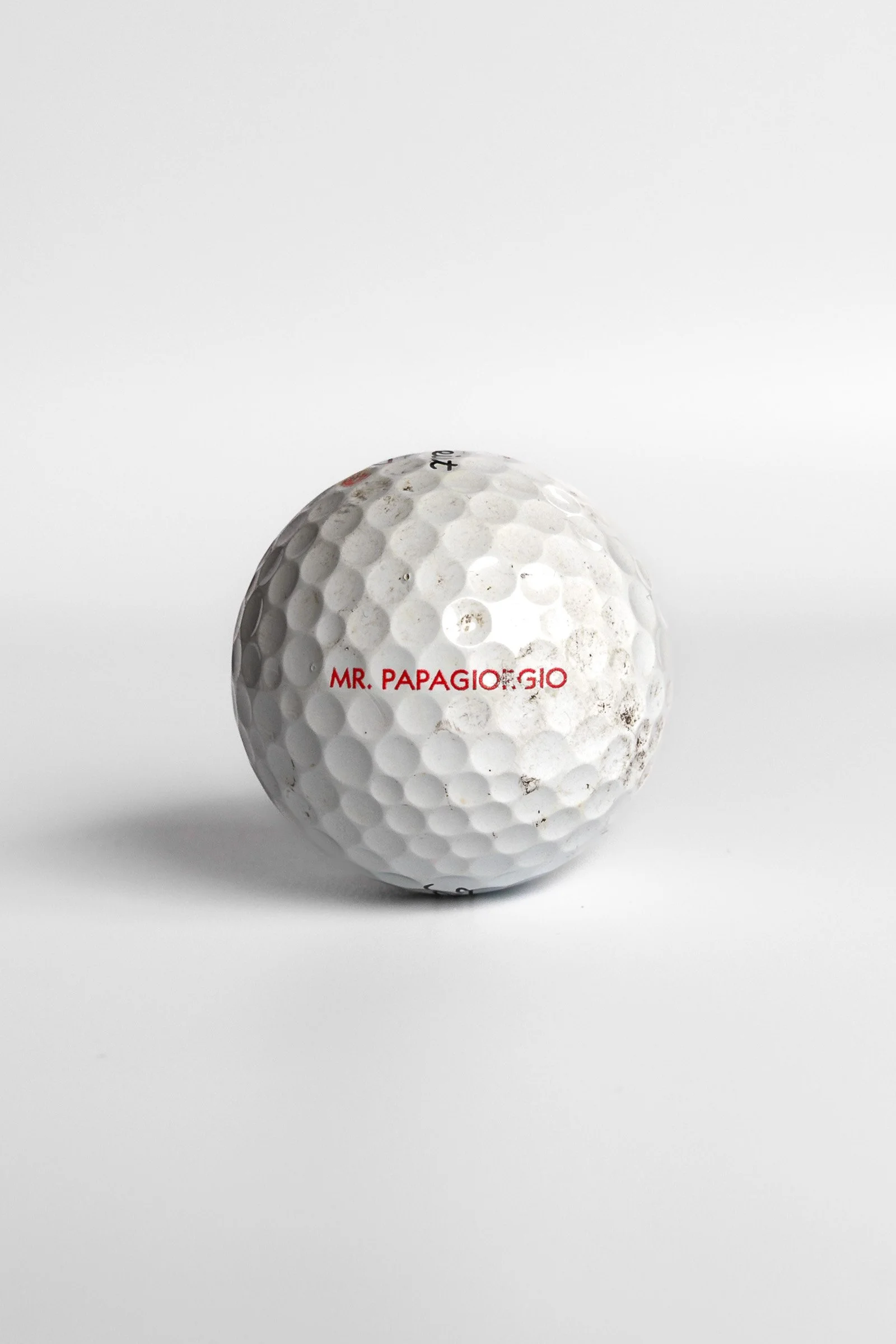 Titleist Pro V1x golf ball with Mr. Papagiorgio text red lettering white background