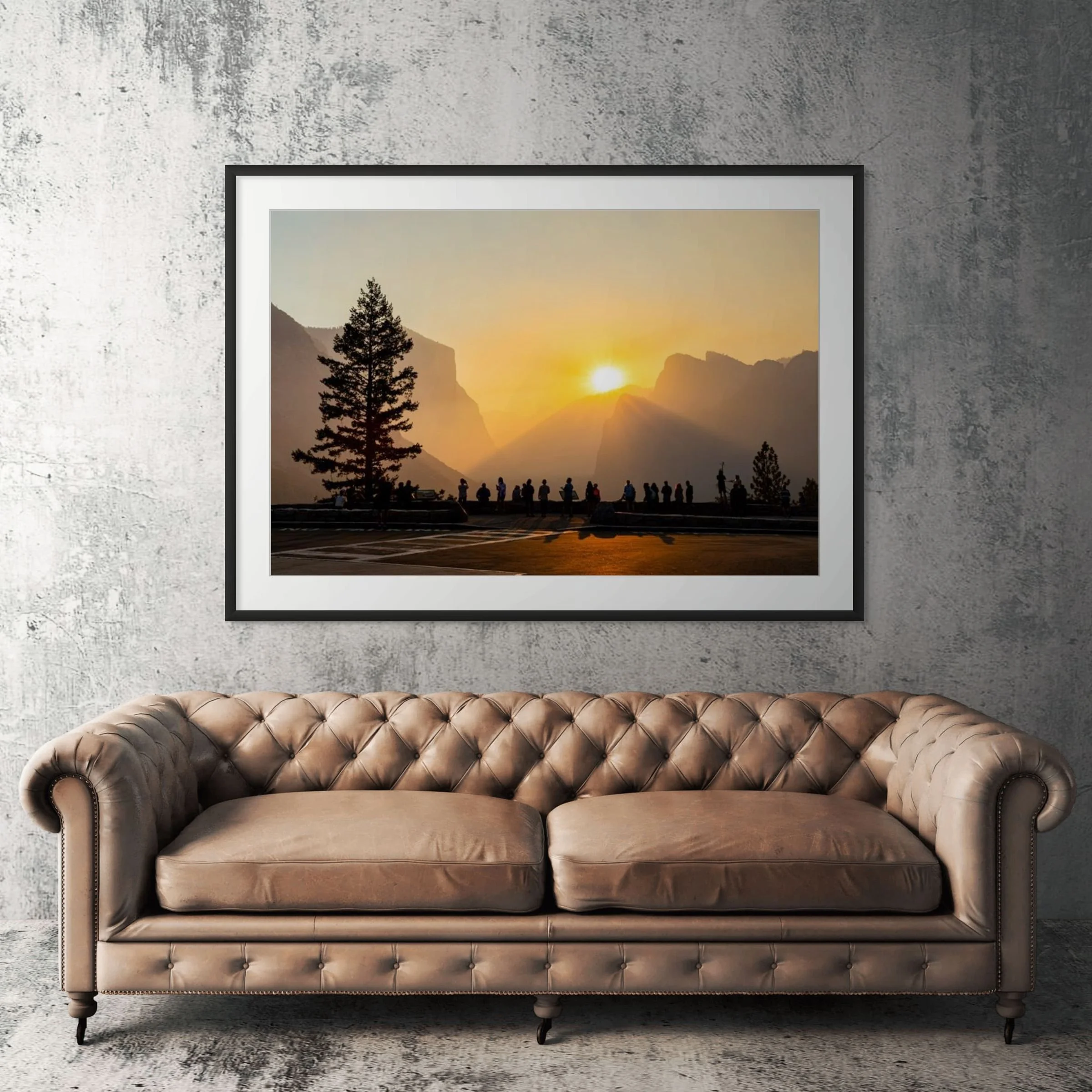 Yosemite Tunnel View sunrise framed print displayed above tan leather sofa in living room