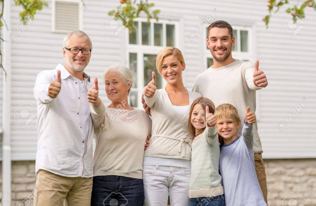34035031-family-happiness-generation-home-and-people-concept-happy-family-standing-in-front-of-house-outdoors.jpg