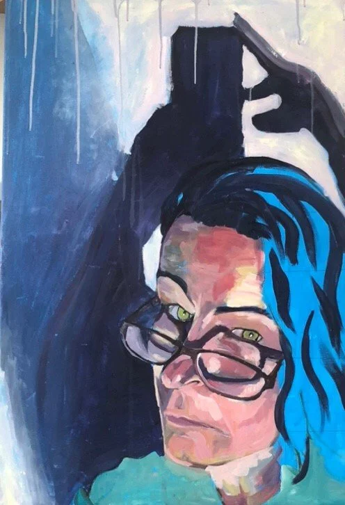 A painted portrait of a woman with colorful blue hair, glasses, and green eyes, with a shadow of a person playing piano in the background.