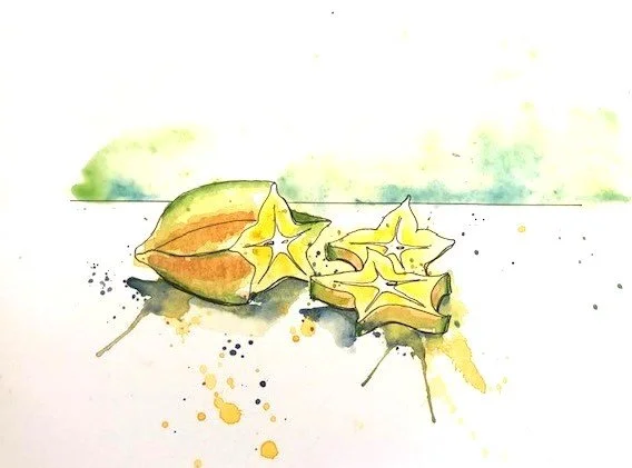 Watercolor painting of a starfruit and two star-shaped slices on a white surface