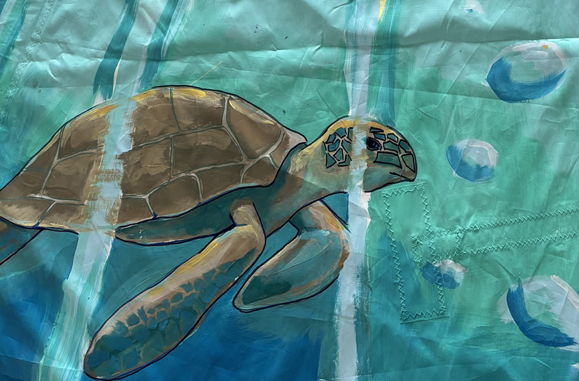 Painting of a sea turtle swimming underwater surrounded by bubbles and water effects.