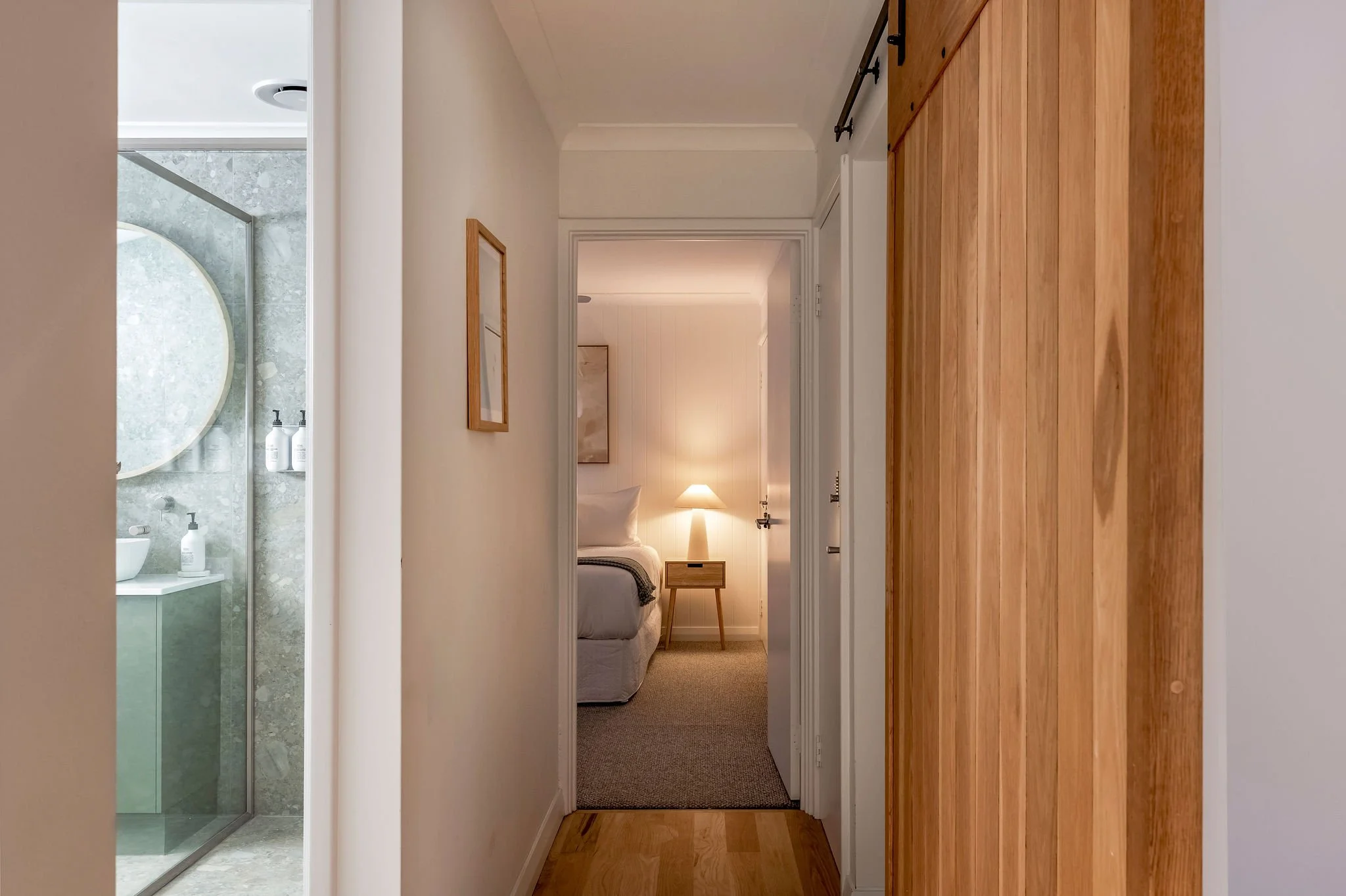 Timber barn door hallway to the bedroom wing and main bathroom, Seastream Haven Dunsborough