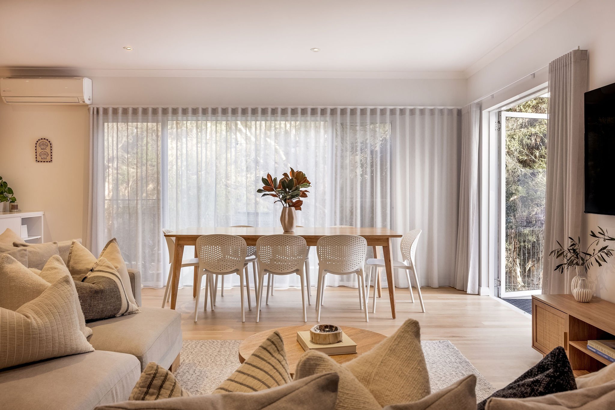 Dining table off the lounge with sliding doors to the deck, Seastream Haven Dunsborough