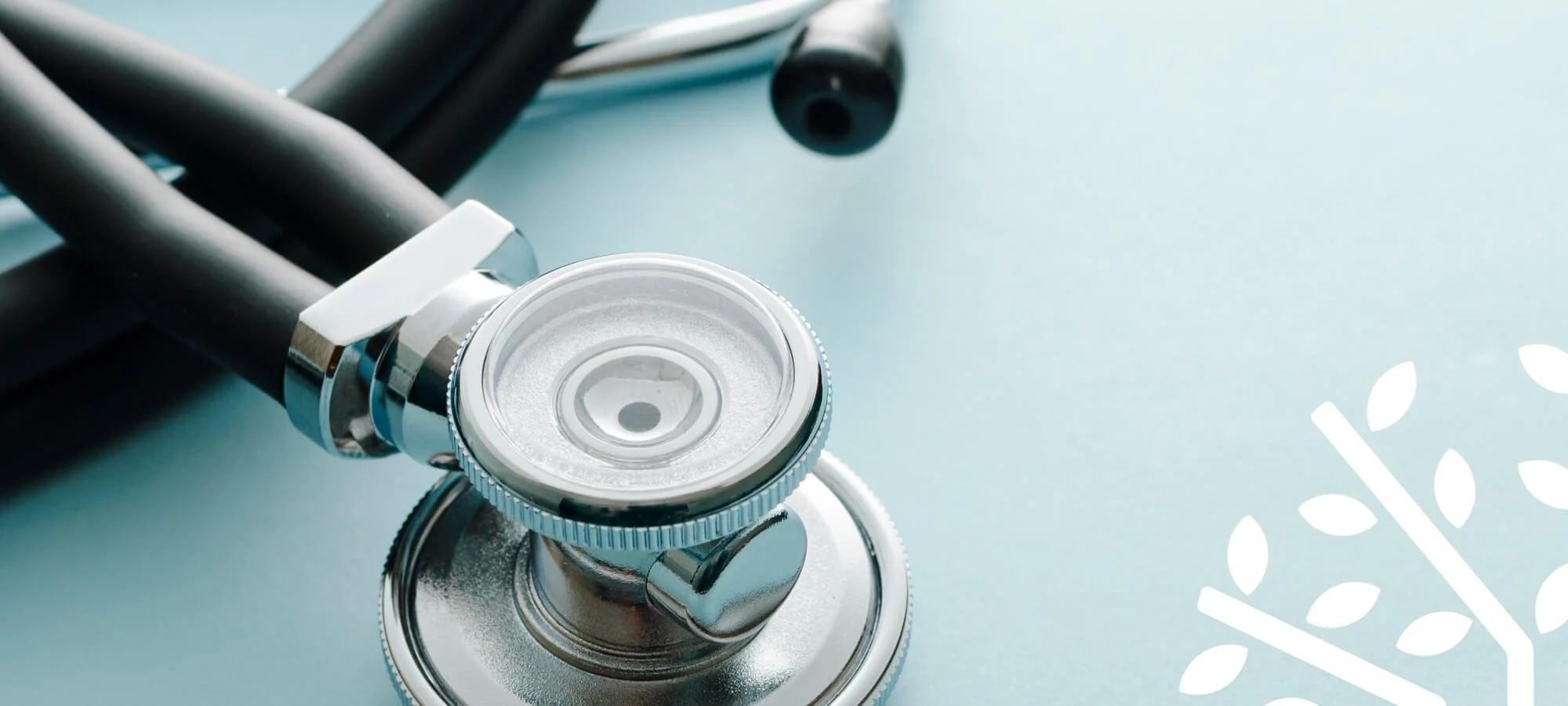 stethoscope on teal background in medical office