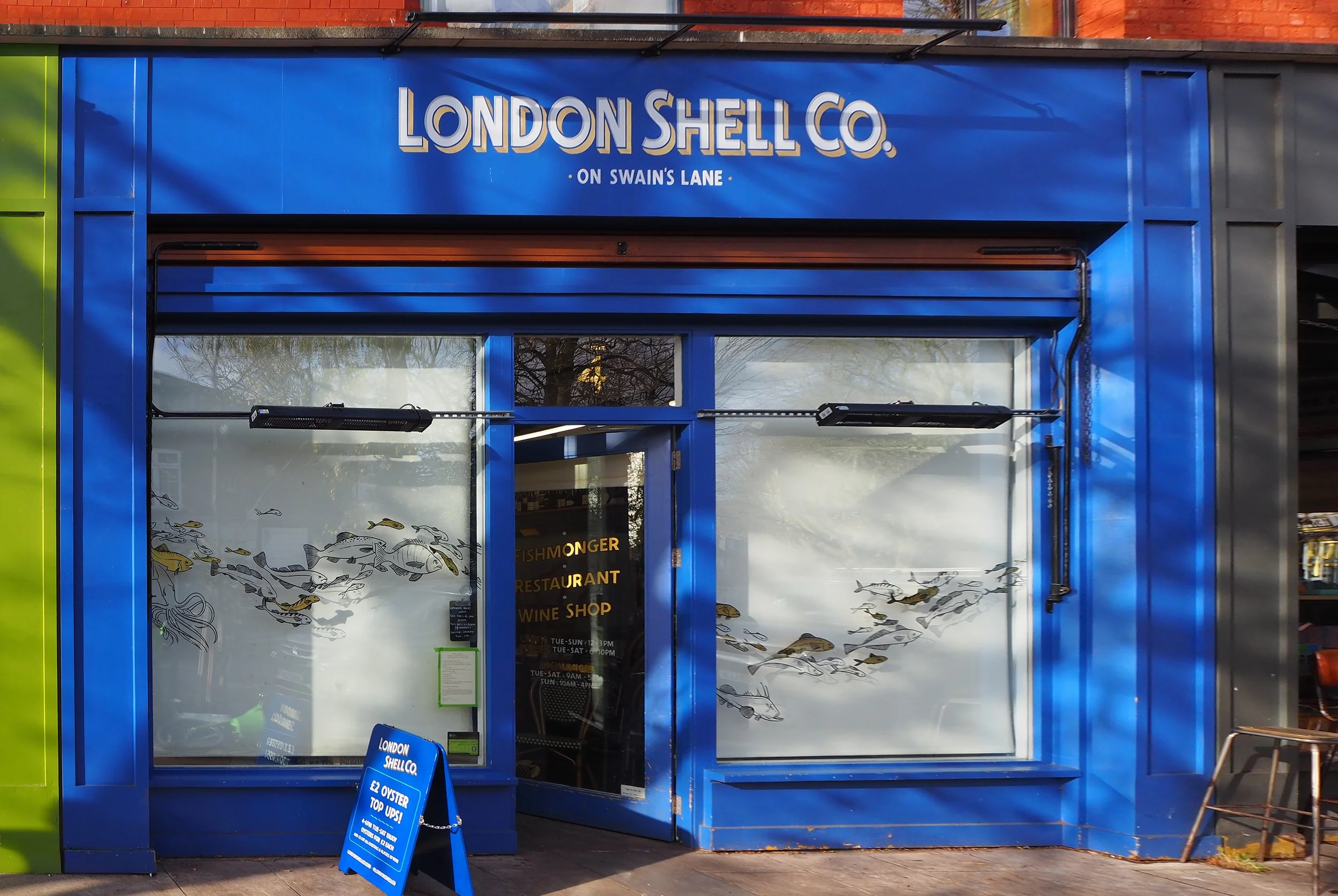 Shopfront signwriting, hanging sign and logo design for London Shell Co fishmongers & restuarant