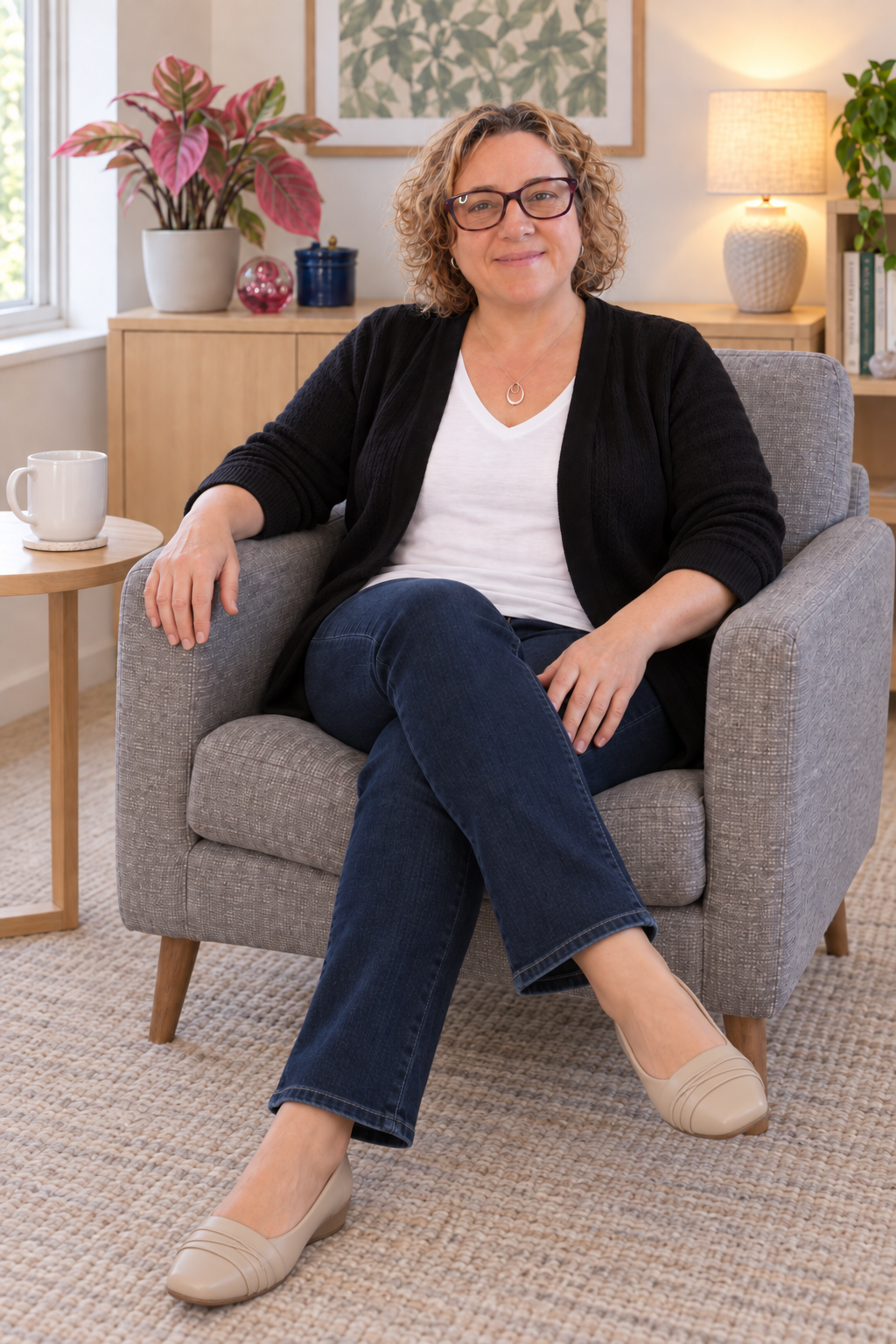 Stephanie Green, registered psychologist, seated and smiling