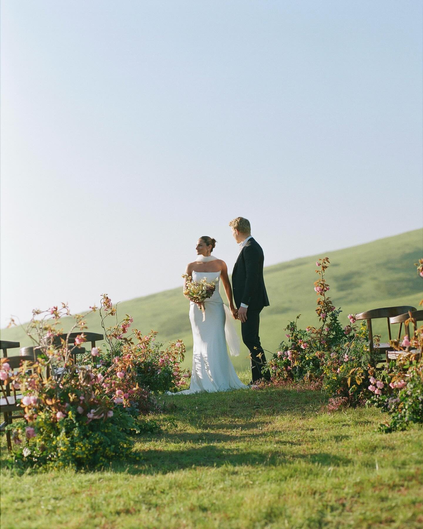Embracing Spring in all its glory featuring blossoming branches for a serene cliffside ceremony overlooking Tomales Bay. 
.
.
.
Planning &amp; Design | @amriandco&nbsp;
Photography | @amandapoolphoto&nbsp;
Florist&nbsp;| @ashandoakfloral&nbsp;
Beauty