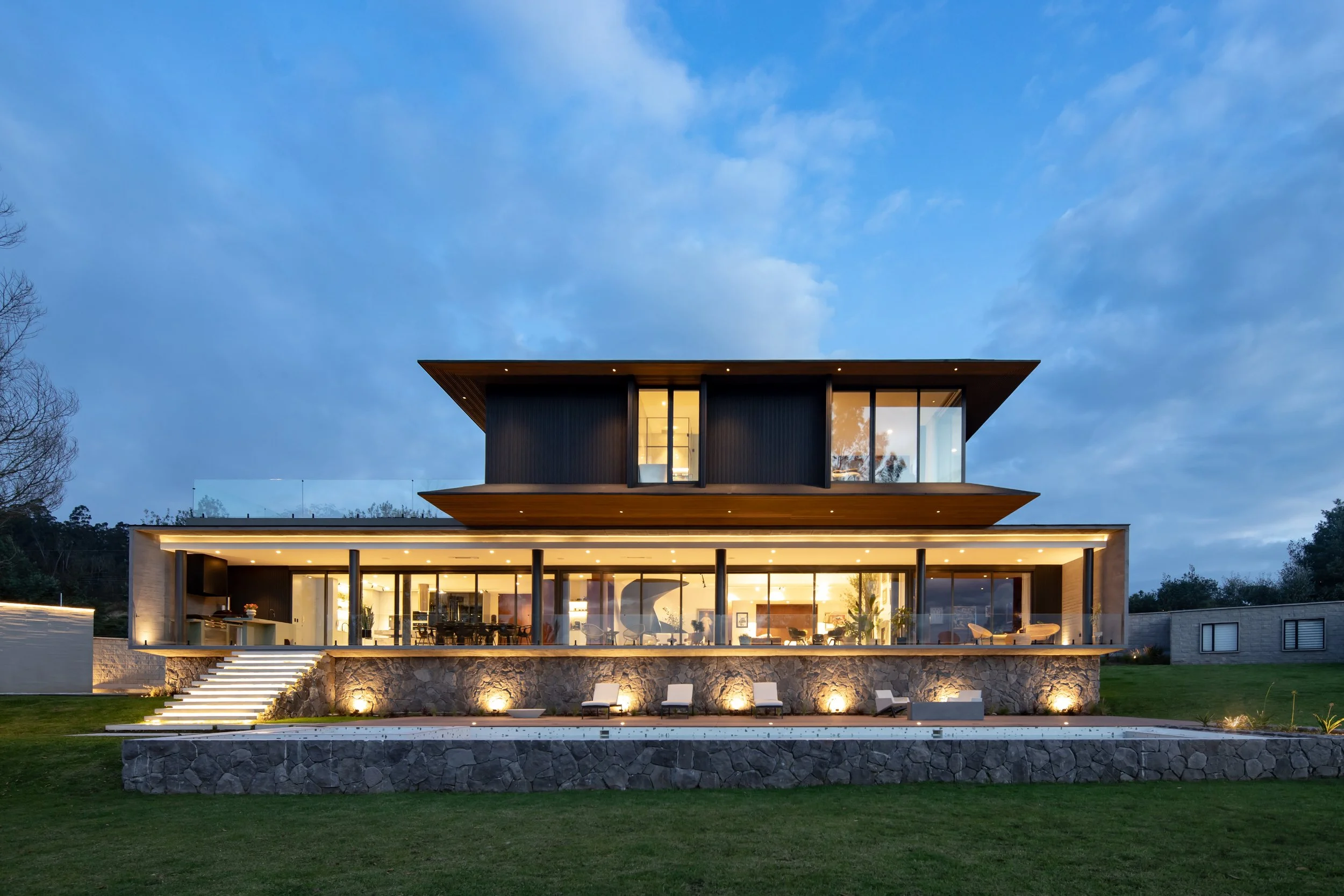 modern facade of a custom residential design, featuring geometric lines and sweeping city views.