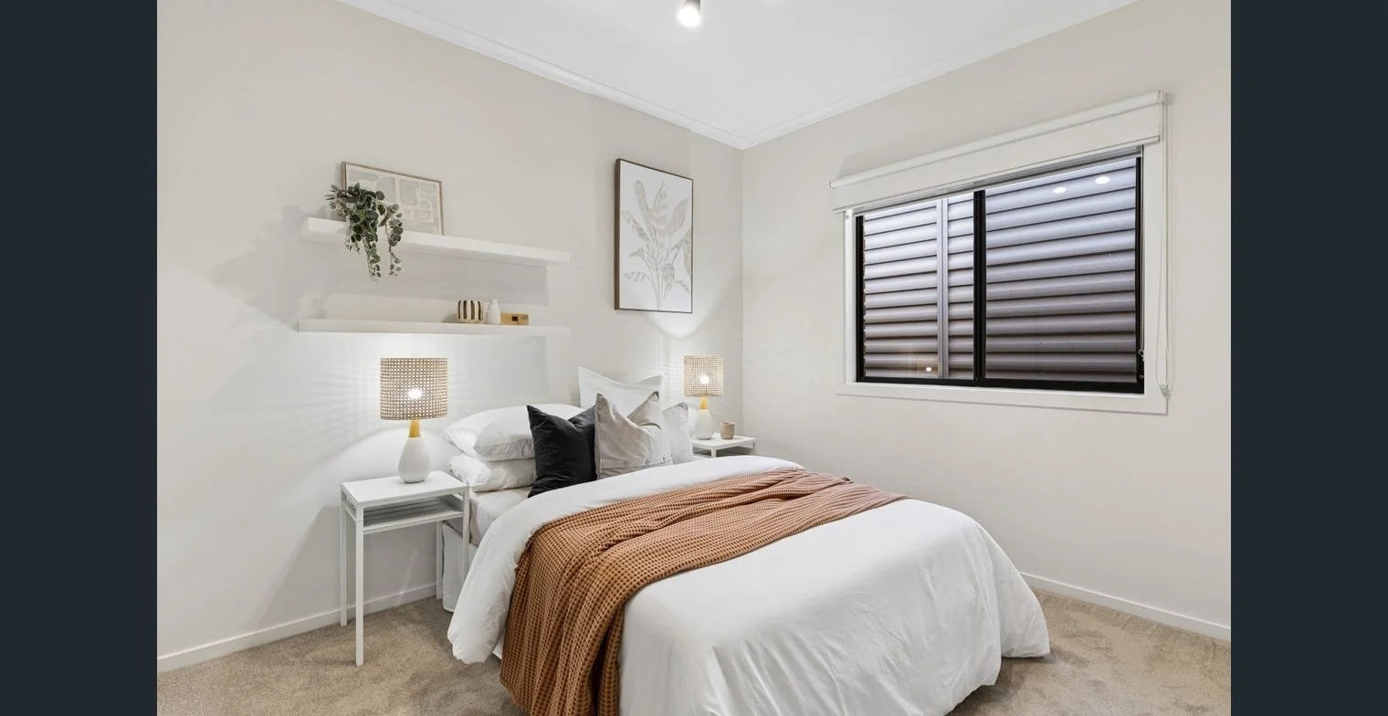 Comfortable bedroom in a professionally presented rental property, styled to attract quality applicants. Strategic property management by Serenity Homes & Design