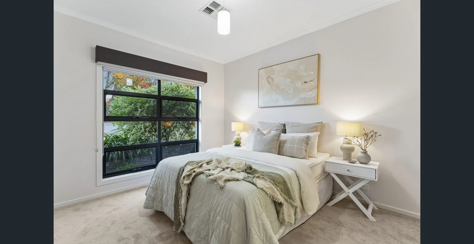 Modern bedroom in a professionally presented rental property leased within one week through strategic property management.