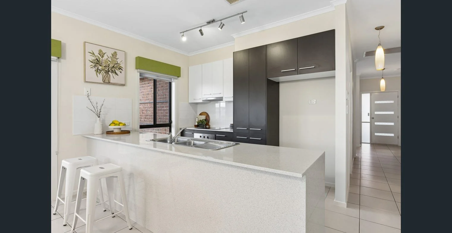 Bright modern kitchen rental property. Strategic property management by Serenity Homes & Design