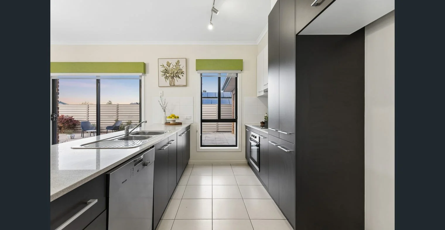 Professionally styled kitchen in a rental home prepared for a fast leasing campaign. Strategic property management by Serenity Homes & Design