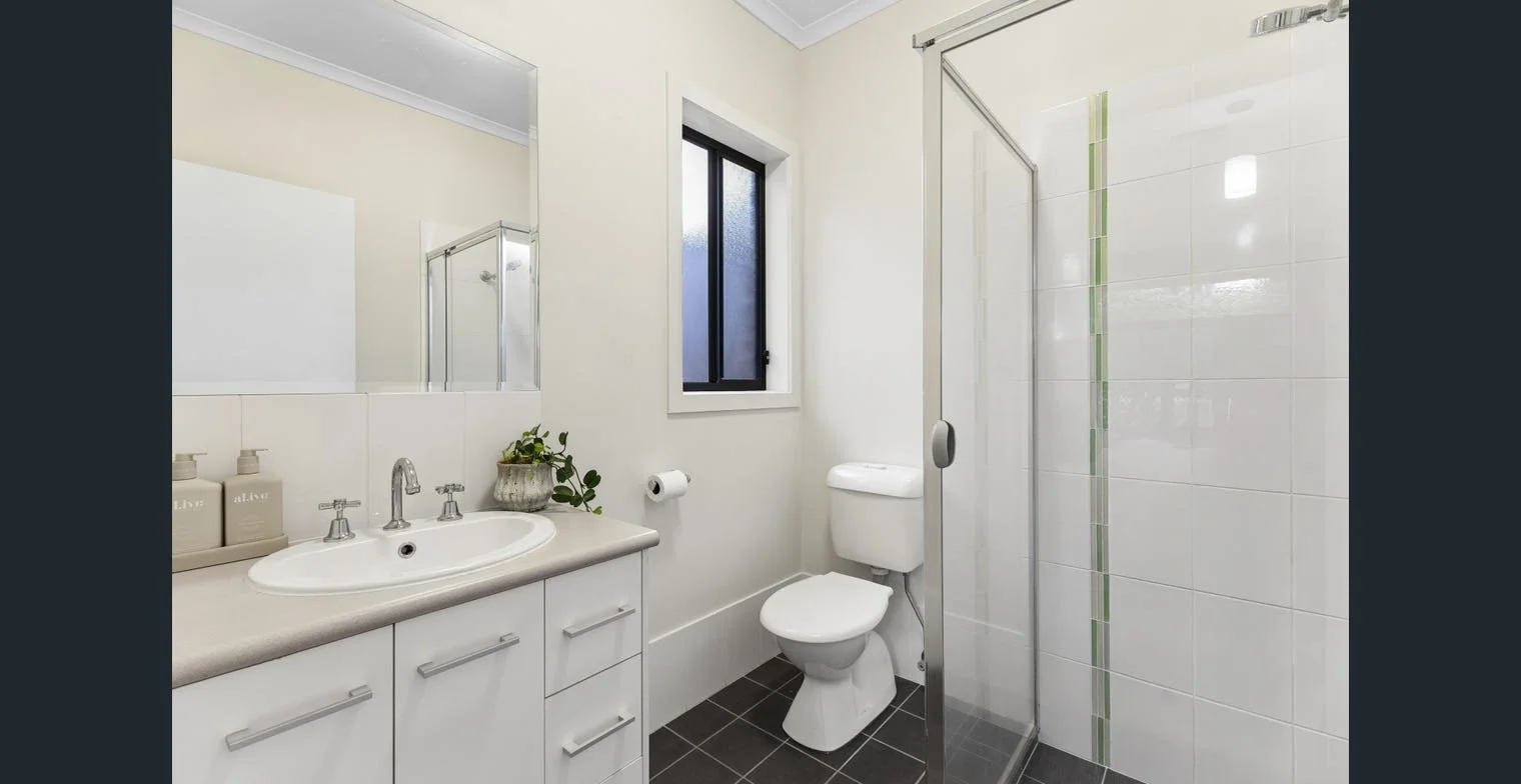 Styled ensuite in a current rental property, presented to attract quality applicants. Strategic property management by Serenity Homes & Design