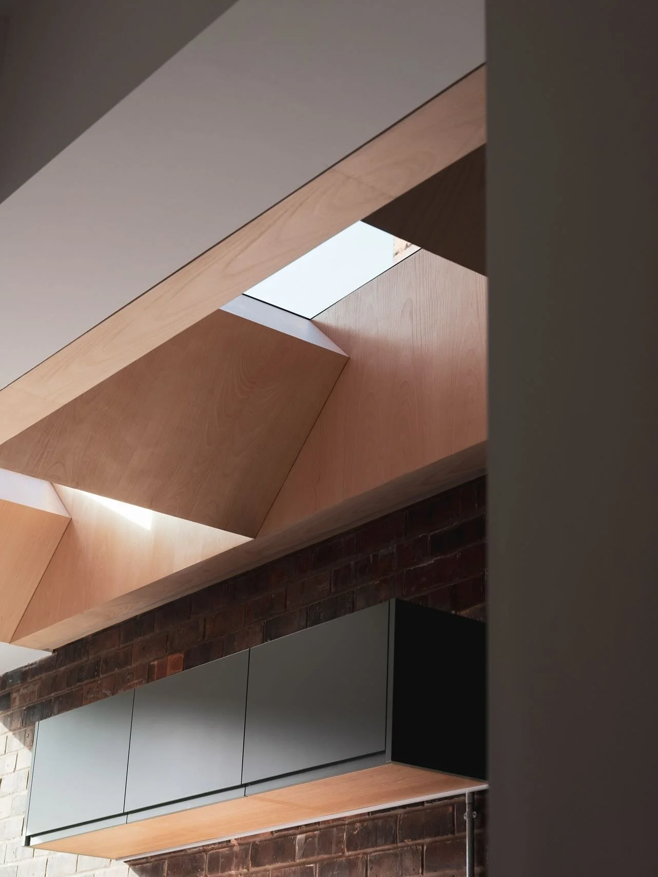 Taking a look back at a project we completed last year. 

The small side extension to this Edwardian terrace creates a new family space directly connected to the garden. The folded timber-lined rooflights bring a unique character and warmth to the sp