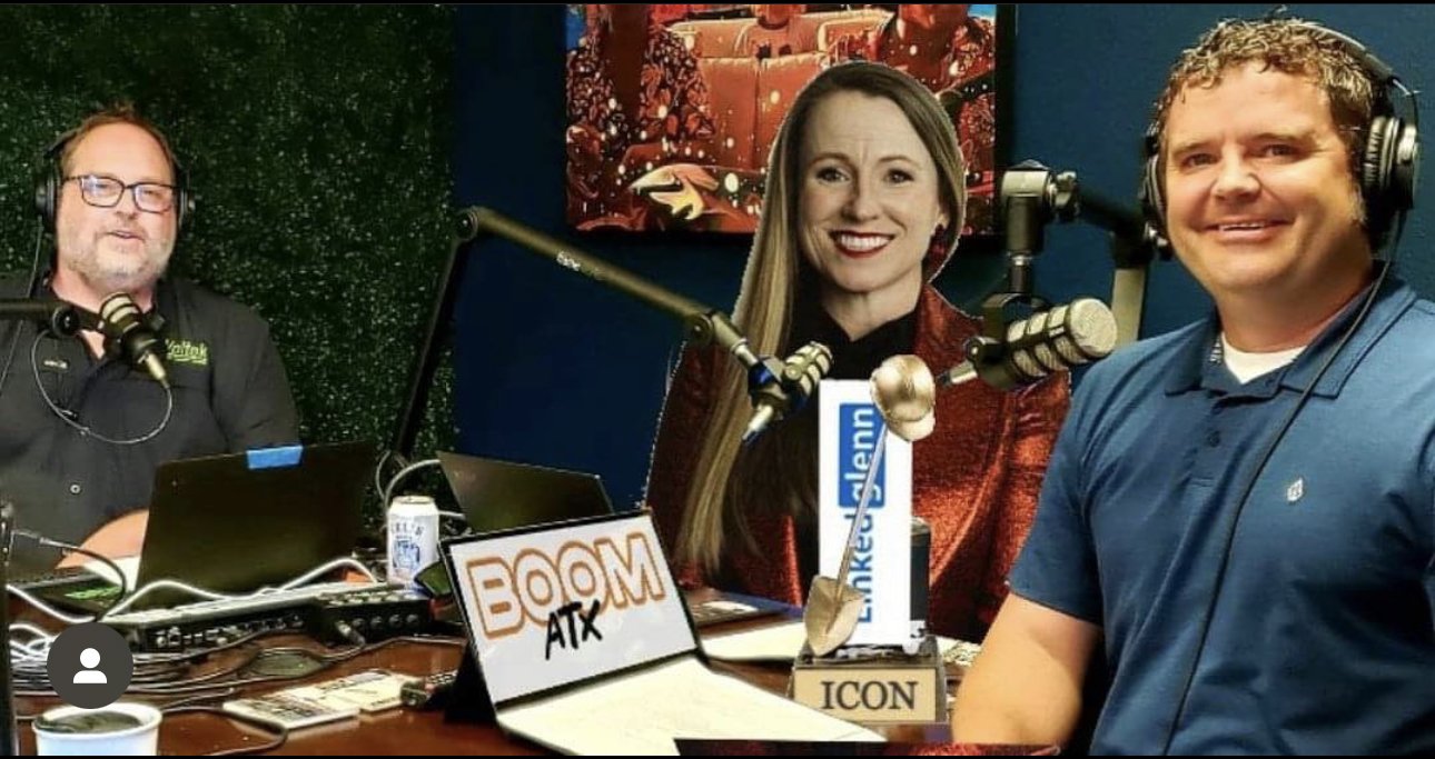 Three people in a podcast studio with microphones and laptops, featuring "BOOM ATX" signage."