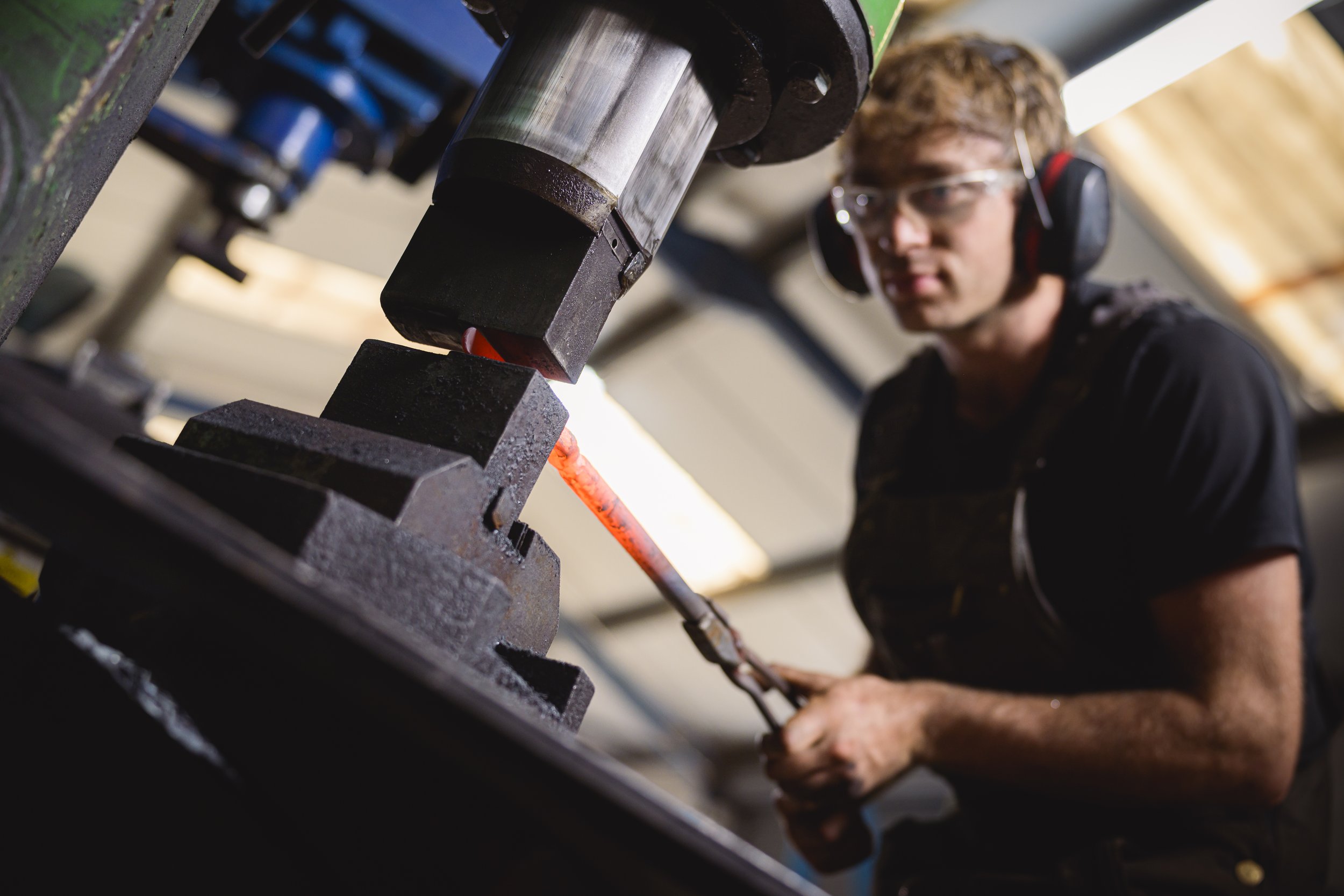 hammering metal on the power hammer
