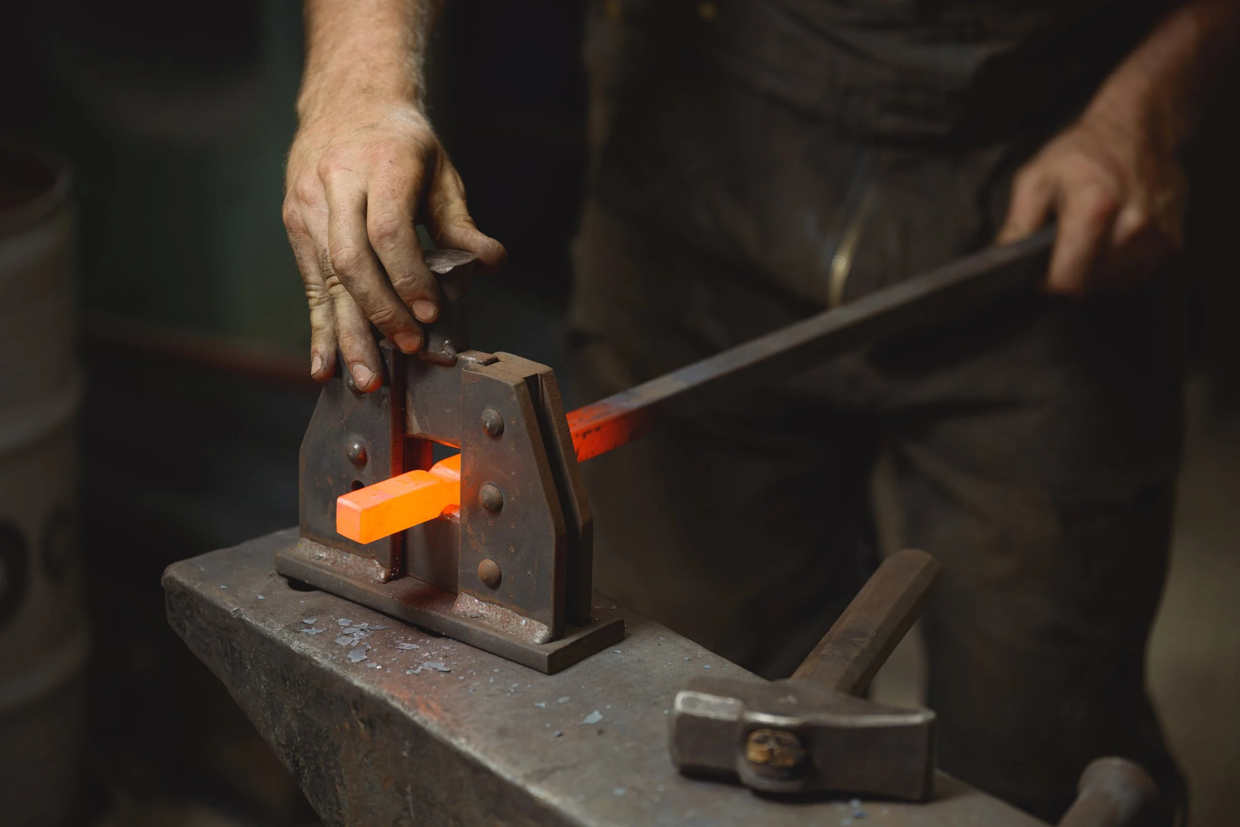 hammering hot metal into shape