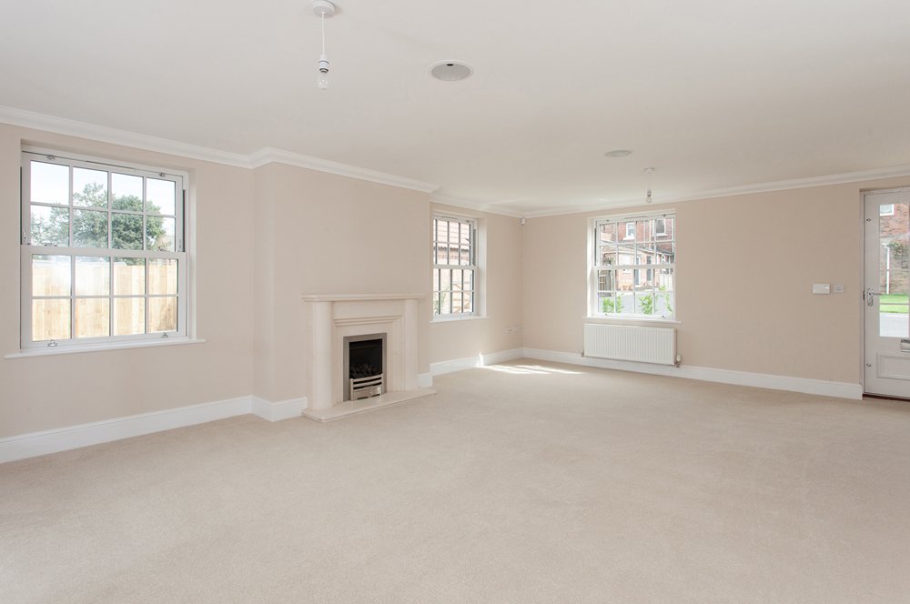  empty magnolia living room with gas fireplace 