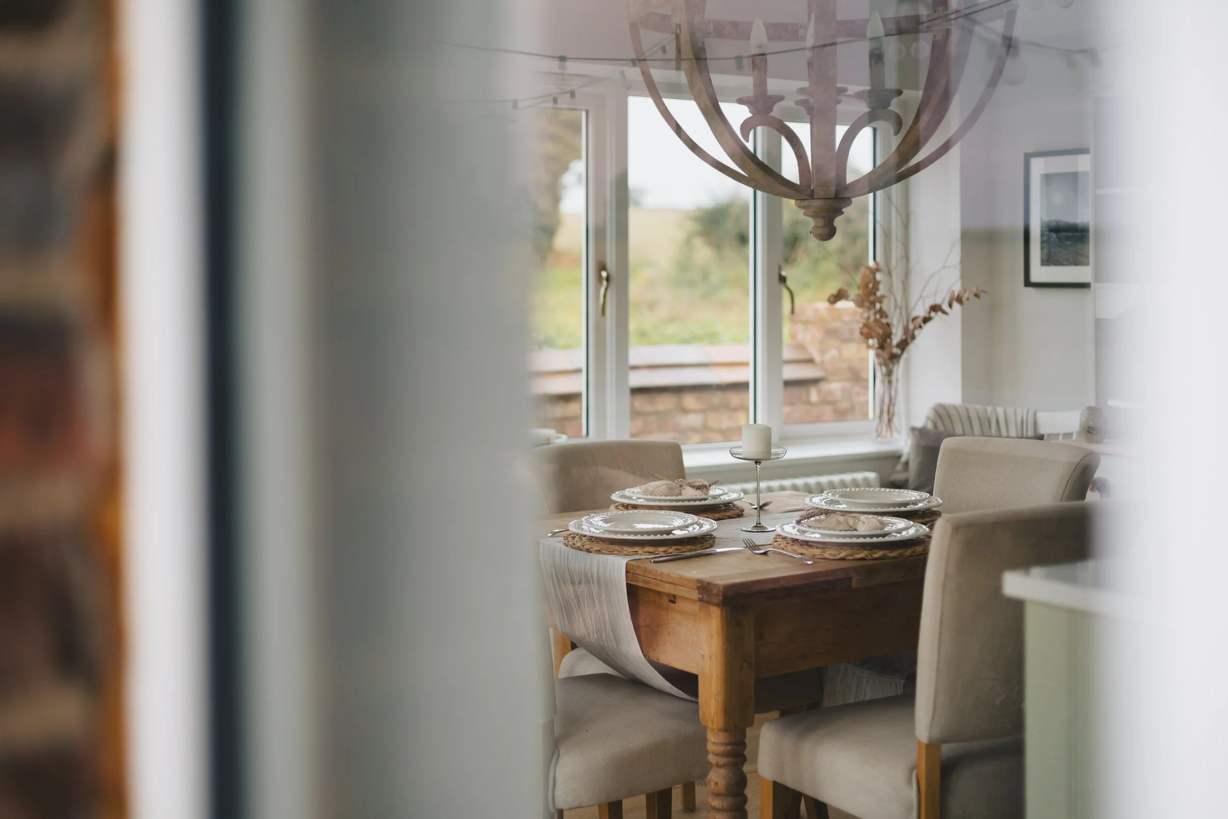 looking in through a window at a dining table