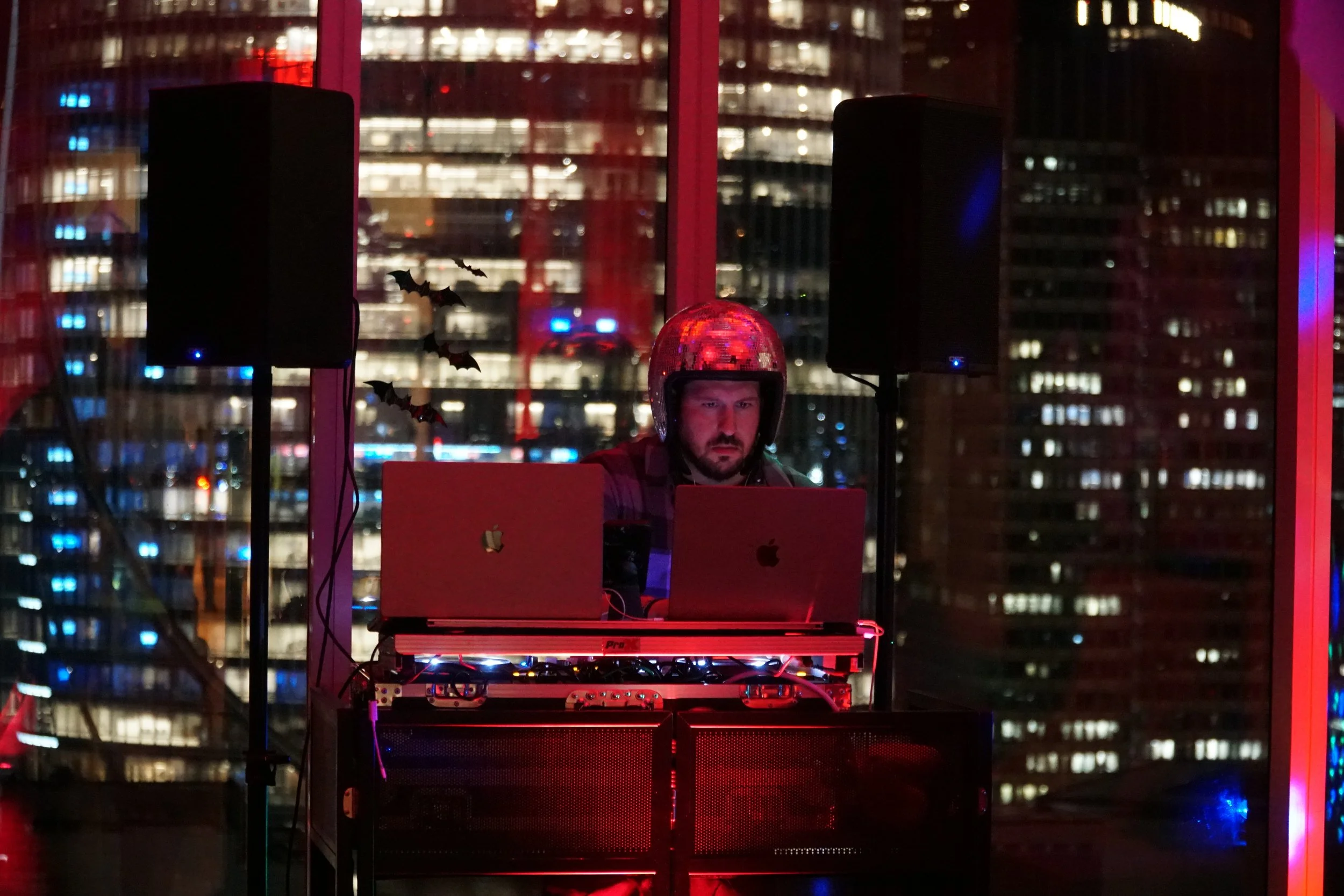 DJ setup overlooking Boston at Hub50House’s October 2024 Halloween event.