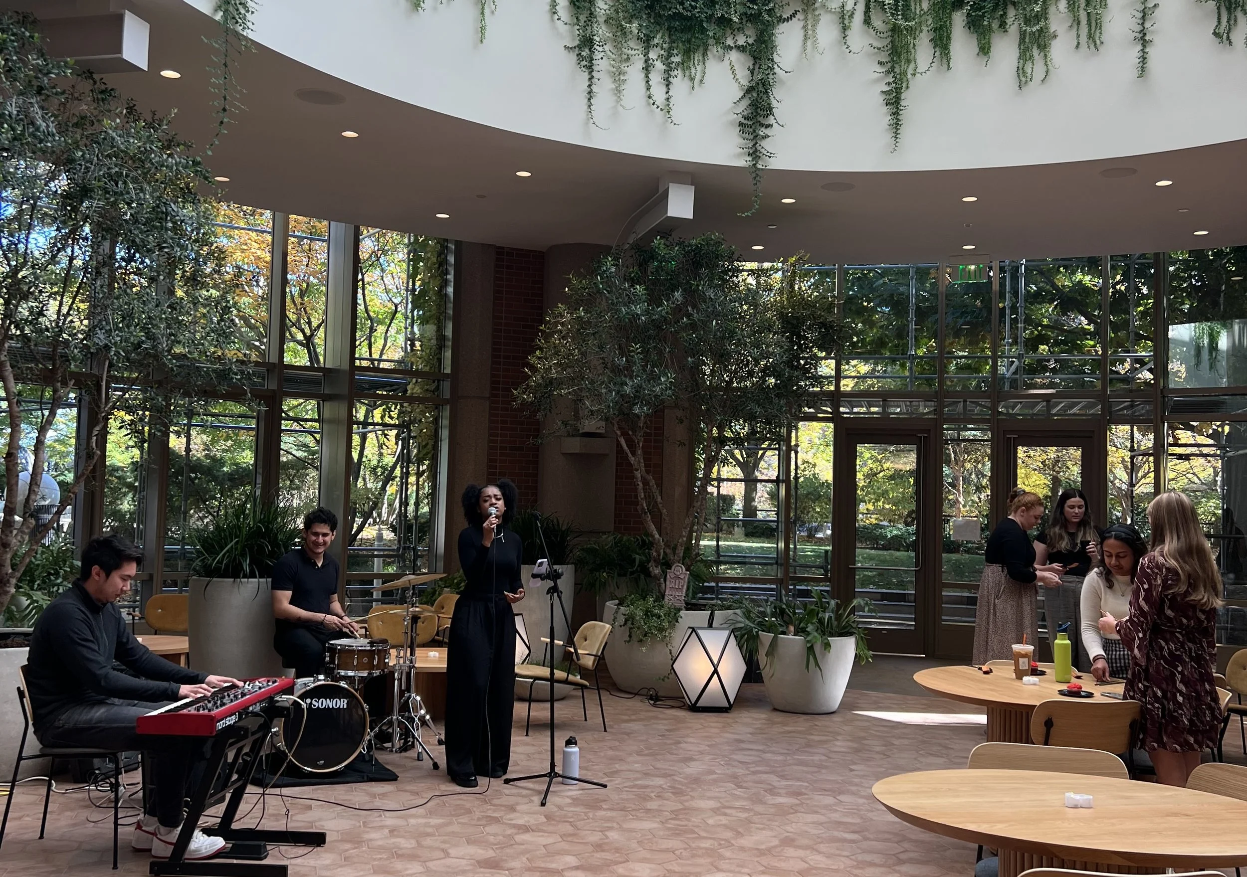 Live trio performing at a Halloween event at 2 Seaport Lane in Boston.