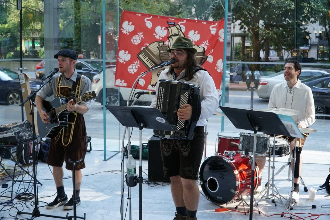 Live Oktoberfest trio performing at a tenant event in downtown Boston