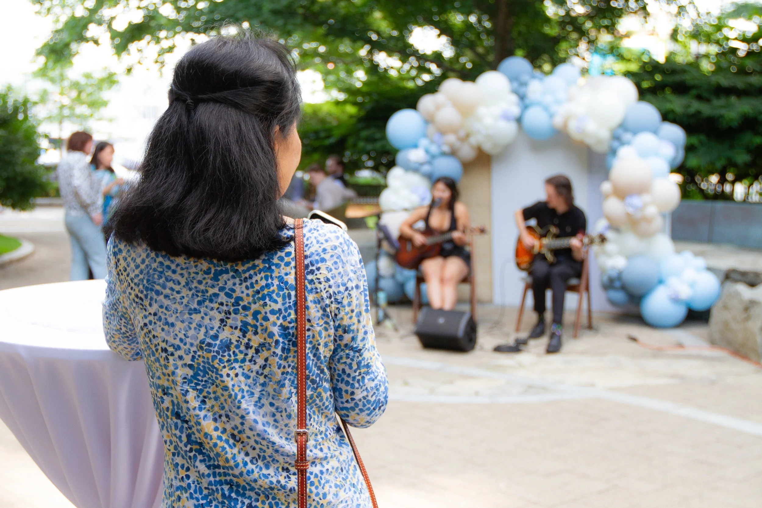 Guest enjoying live music during a summer tenant event at Commonwealth Pier