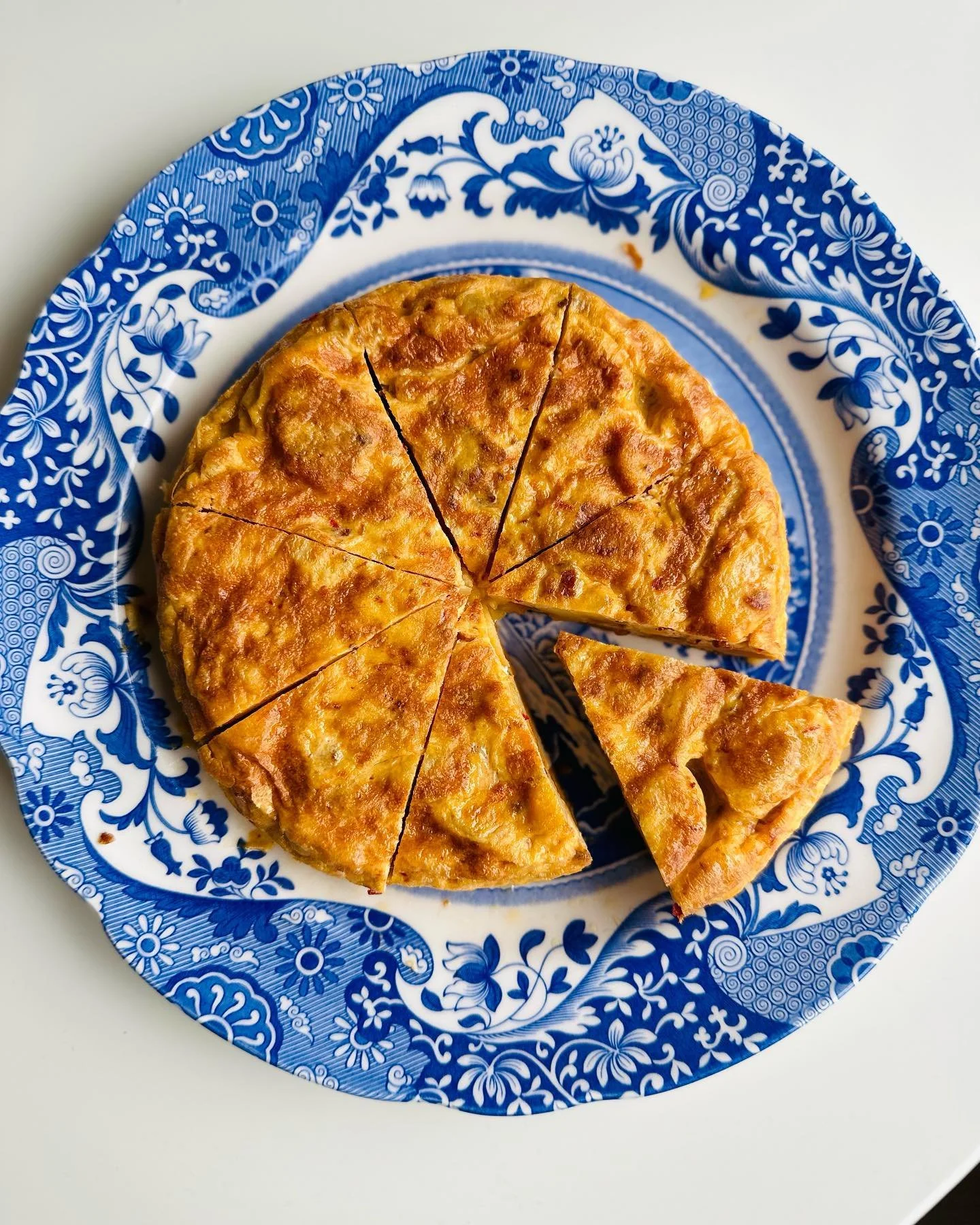 Spanish omelet, also known as Tortilla Espa&ntilde;ola.

With eggs, potato and onion nothing can go wrong! I make sure to always have these ingredients at home so I can make a quick meal. 
Ingredients:
- 4-5 medium-sized potatoes
- 1 large onion
- 6-
