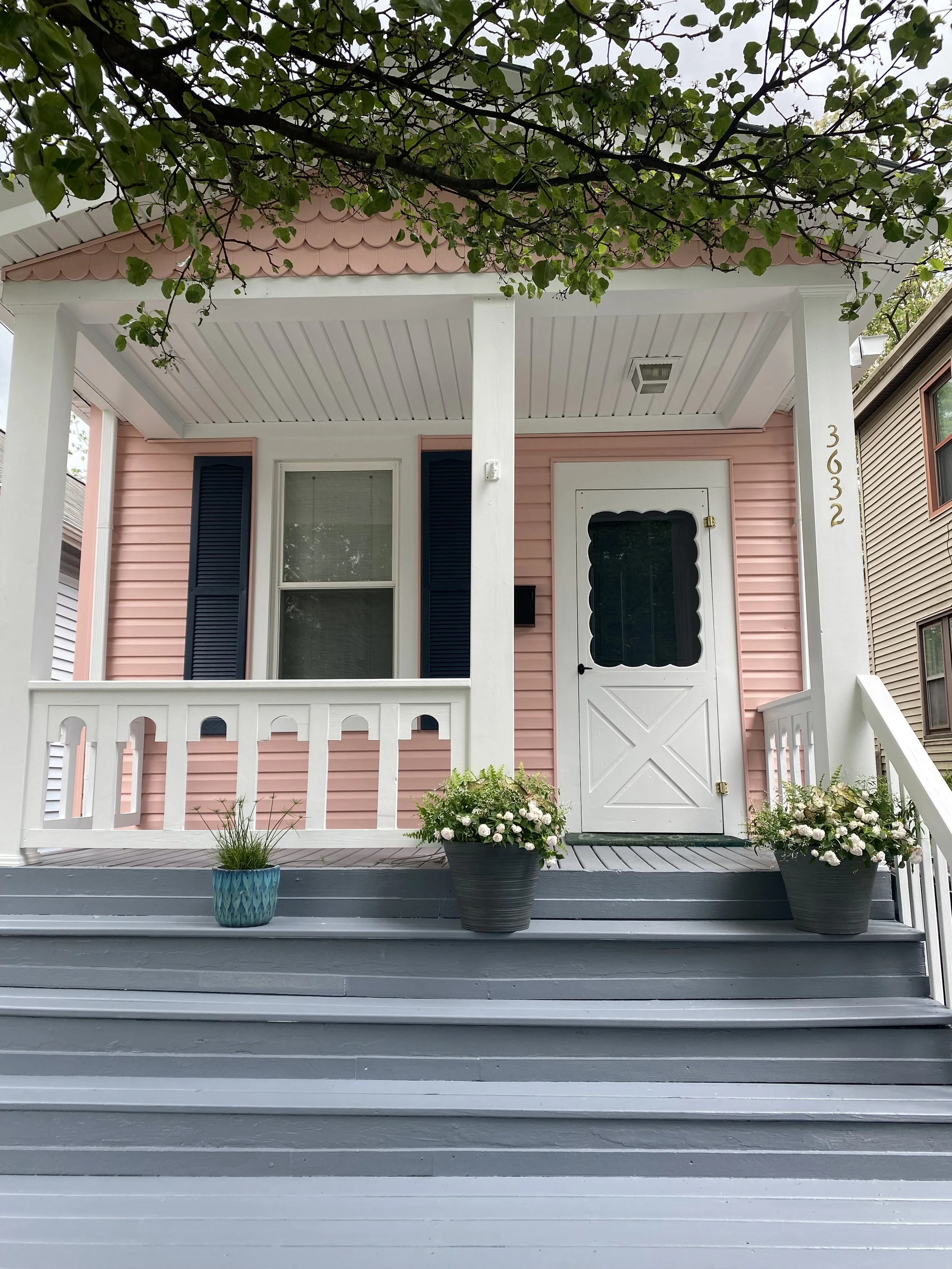 Porch and flowers of pink house in Hyde Park, a suburb of Cincinnati Ohio