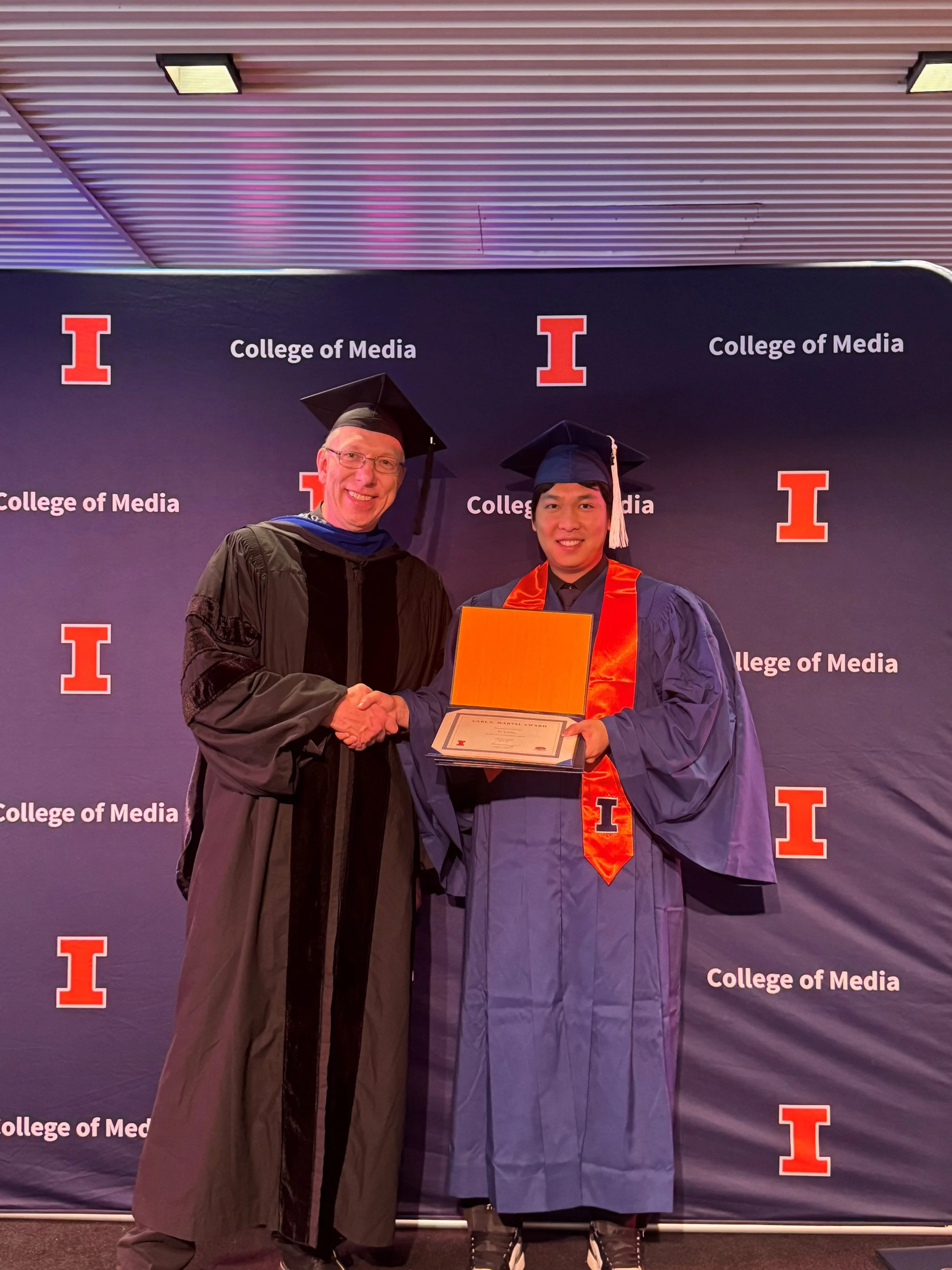 Wilfred and Yi celebrating. Congratulations to Yi Yang for his graduation and receiving the Carl S. Marvel Award. The Department of Chemistry extends the award to honor a top student for distinction in undergraduate research.